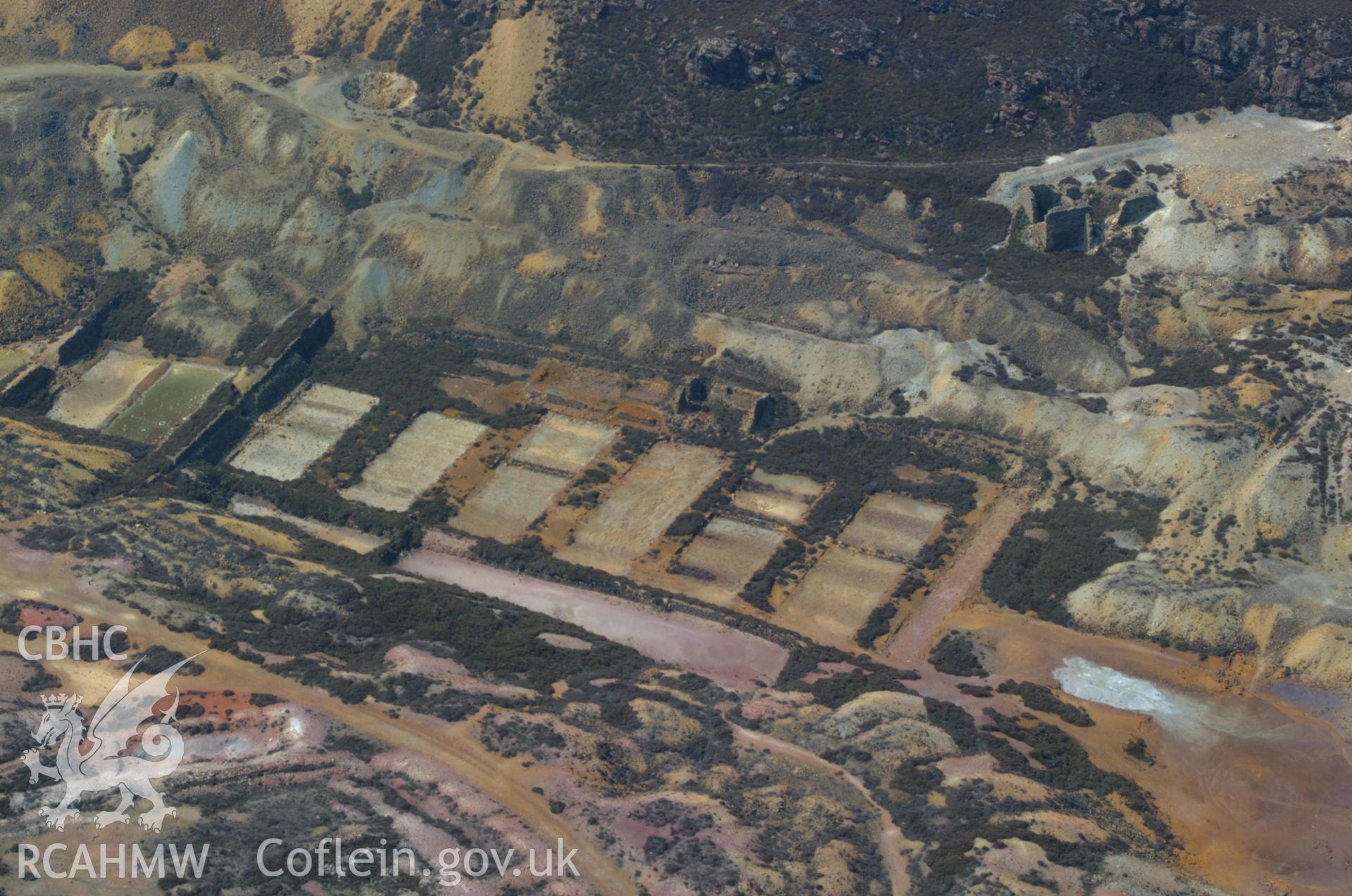 RCAHMW colour oblique aerial photograph of Parys Copper Mine, Amlwch taken on 26/05/2004 by Toby Driver