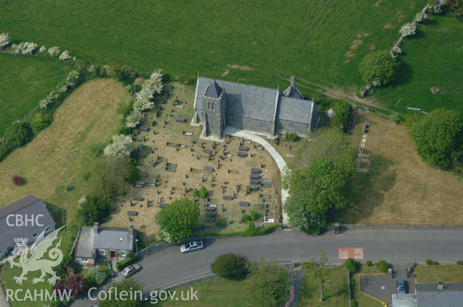 RCAHMW colour oblique aerial photograph of Saints Marcellus and Marcellinus' Church taken on 26/05/2004 by Toby Driver