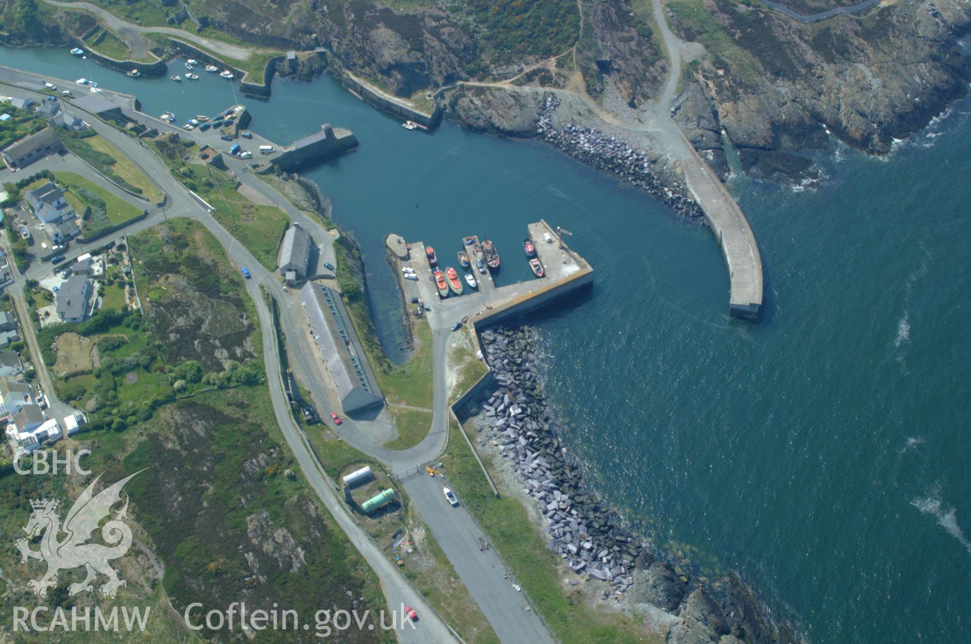 RCAHMW colour oblique aerial photograph of Porth Amlwch (Amlwch Port). Taken on 26 May 2004 by Toby Driver