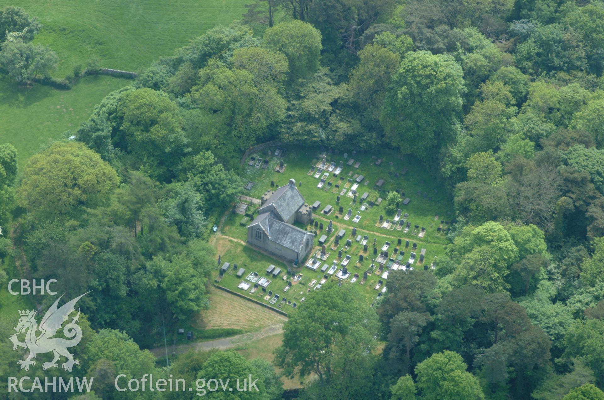RCAHMW colour oblique aerial photograph of St Eugrads Church taken on 26/05/2004 by Toby Driver