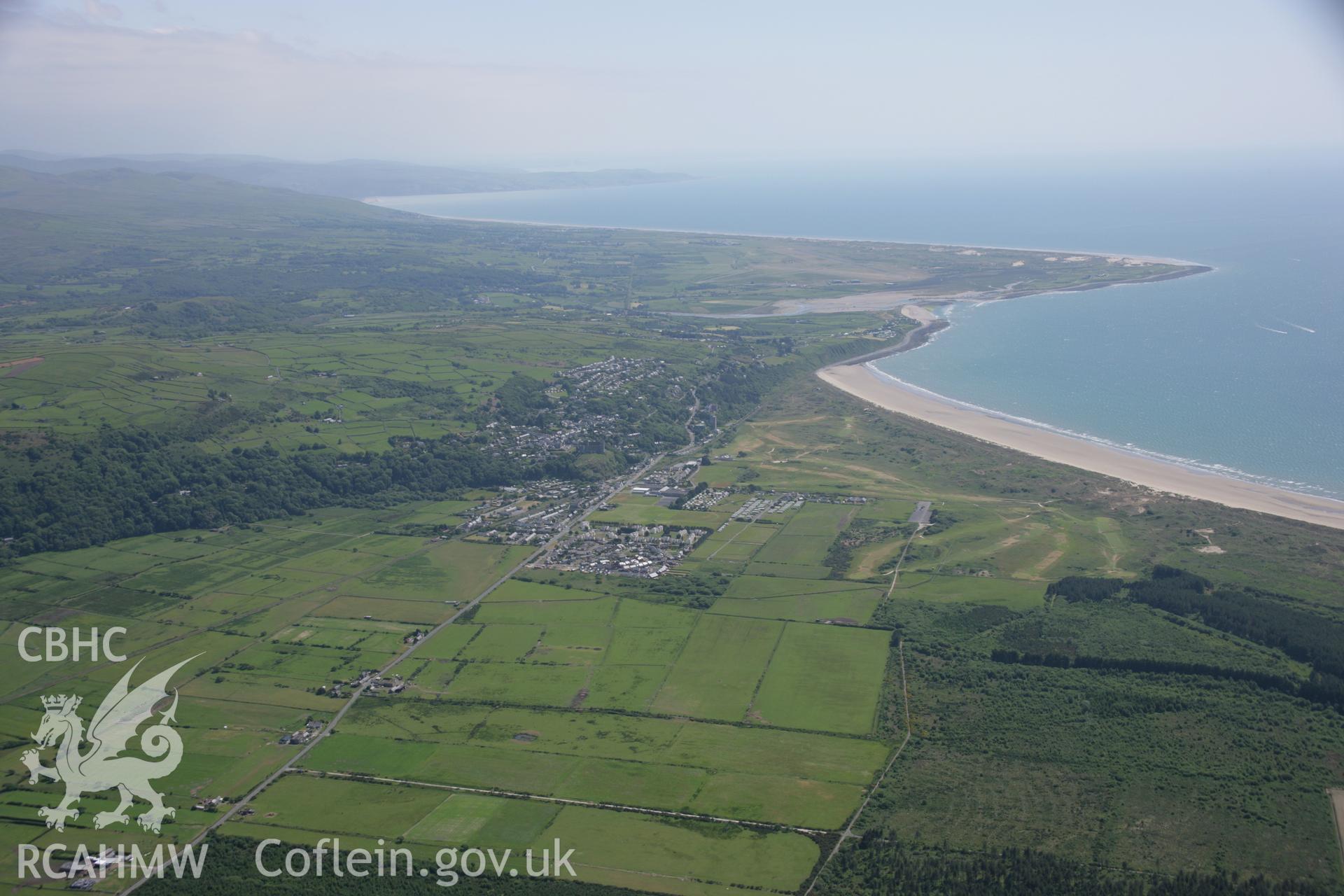 RCAHMW colour oblique aerial photograph of Harlech. A distant view, including the town, from the north. Taken on 14 June 2006 by Toby Driver.
