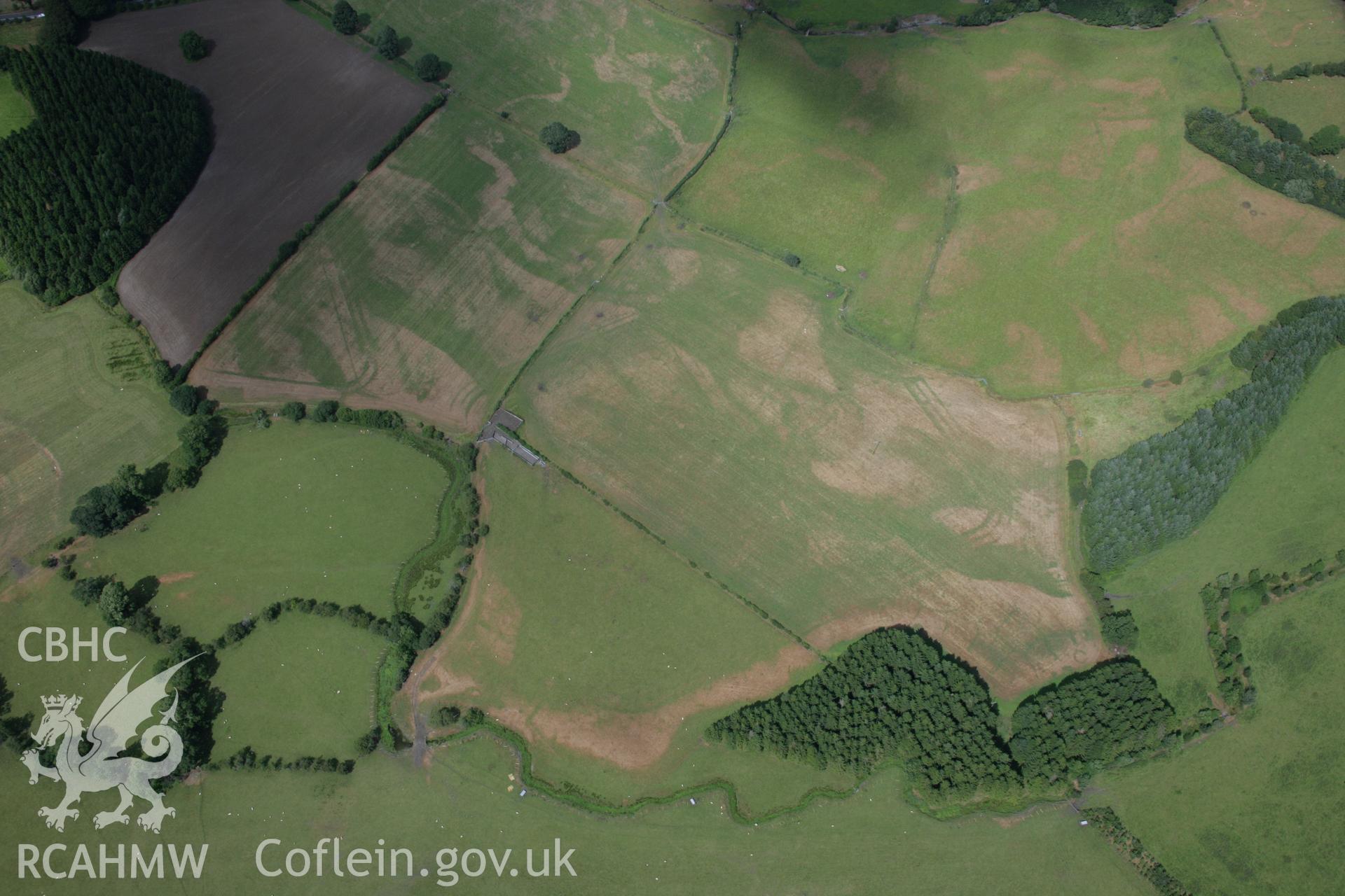 RCAHMW colour oblique aerial photograph of Llanfor Roman Military Complex visible in cropmarks, in general view from the south-west. Taken on 31 July 2006 by Toby Driver.