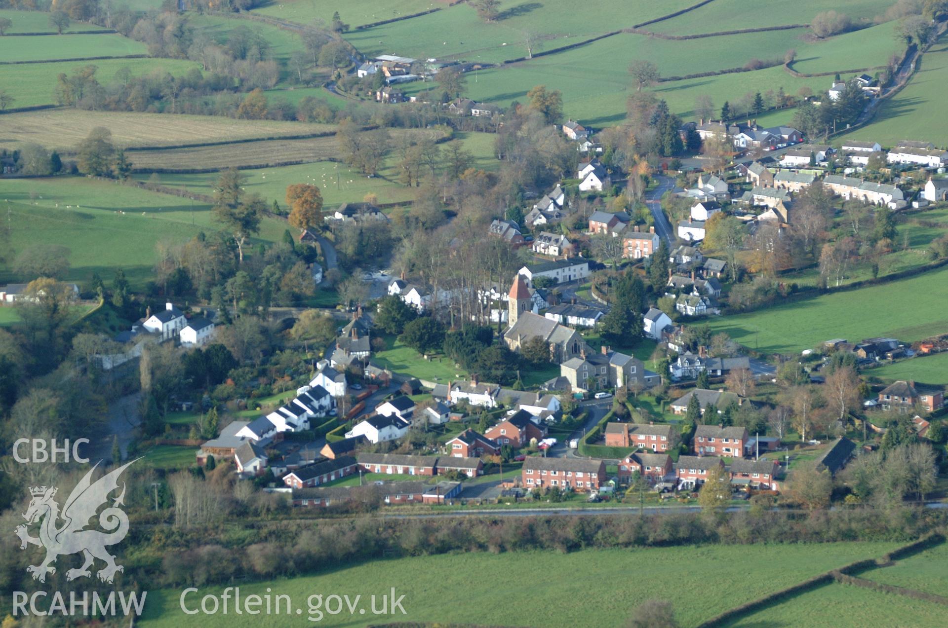 RCAHMW colour oblique aerial photograph of St Beuno's Church, Berriew Village, viewed from the south-east. Taken on 19 November 2004 by Toby Driver
