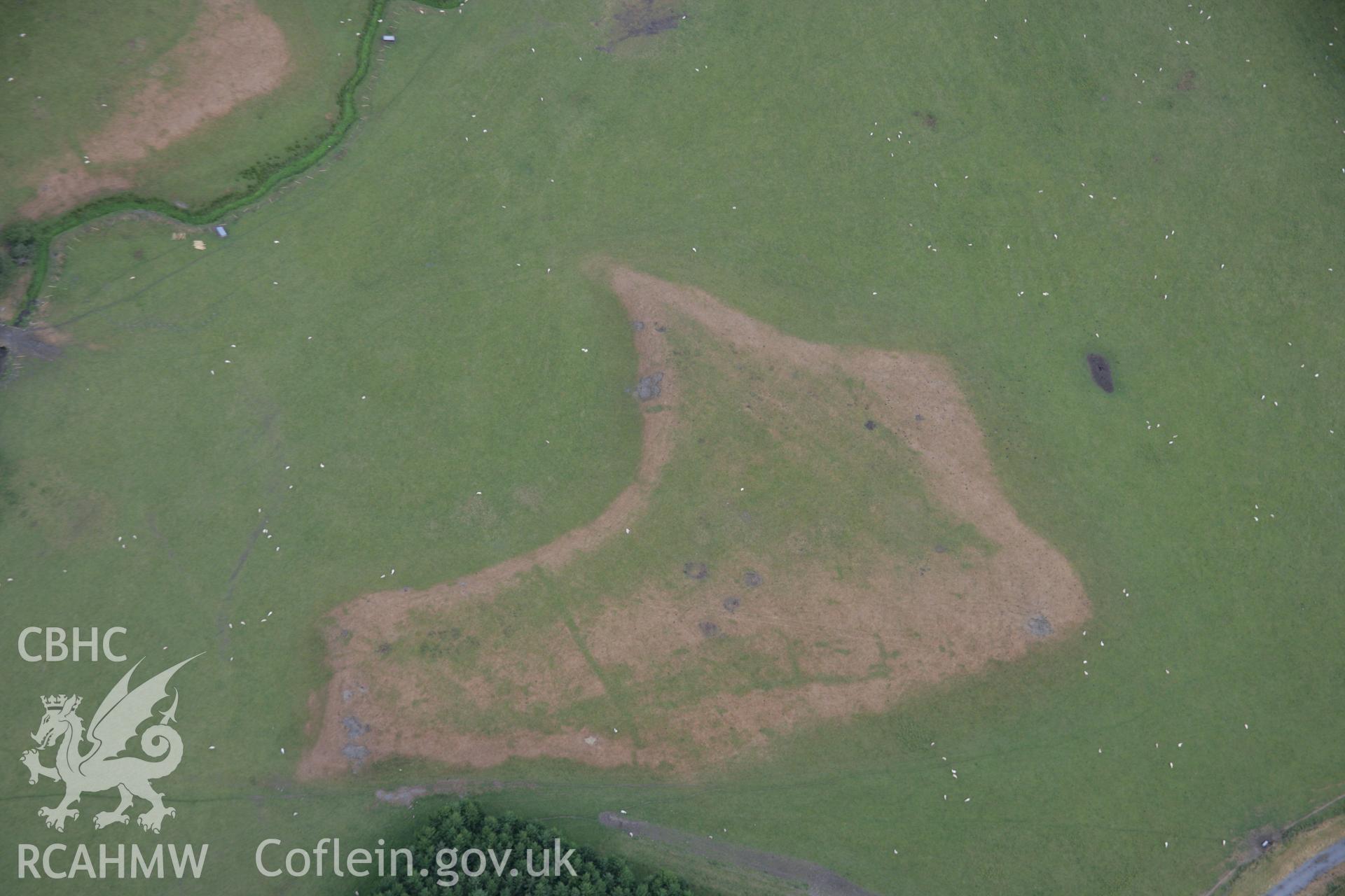RCAHMW colour oblique aerial photograph of Llanfor Roman Military Complex cropmarks on river terrace to south, viewed from the south. Taken on 31 July 2006 by Toby Driver.