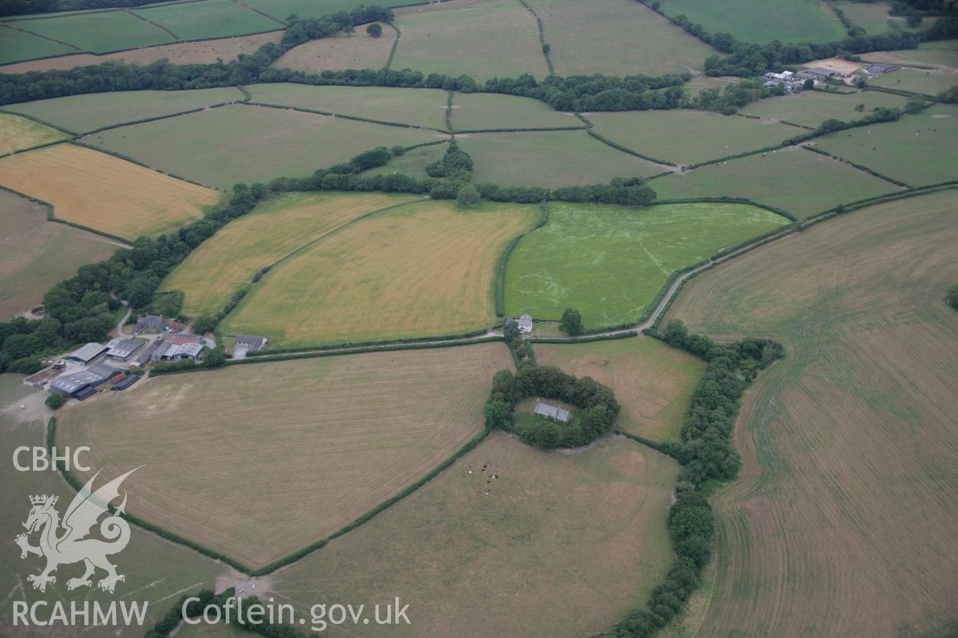 RCAHMW colour oblique aerial photograph of Llangan Church and cropmarks. Taken on 27 July 2006 by Toby Driver.
