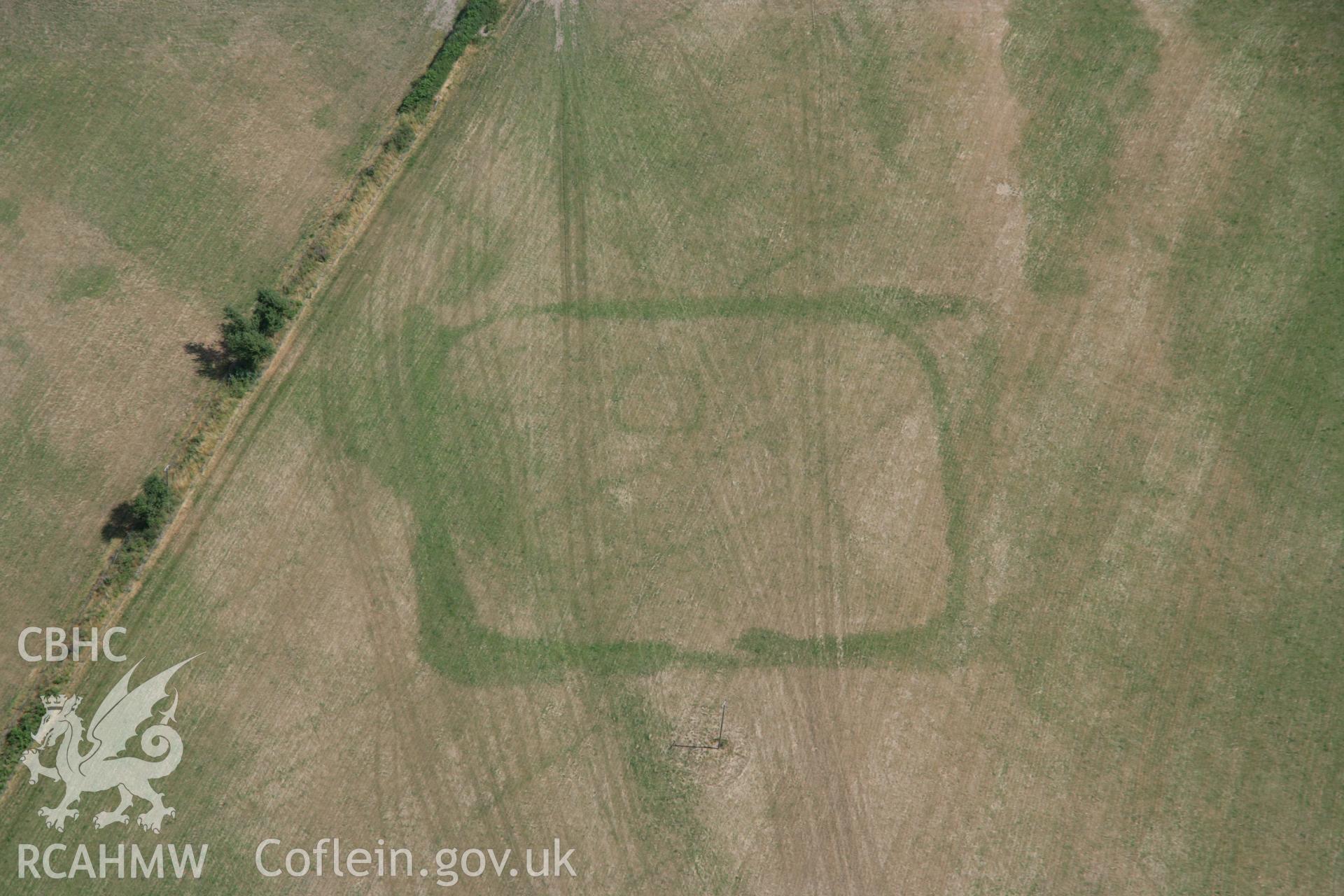 RCAHMW colour oblique aerial photograph of cropmark enclosures west of Caerau. Taken on 27 July 2006 by Toby Driver.