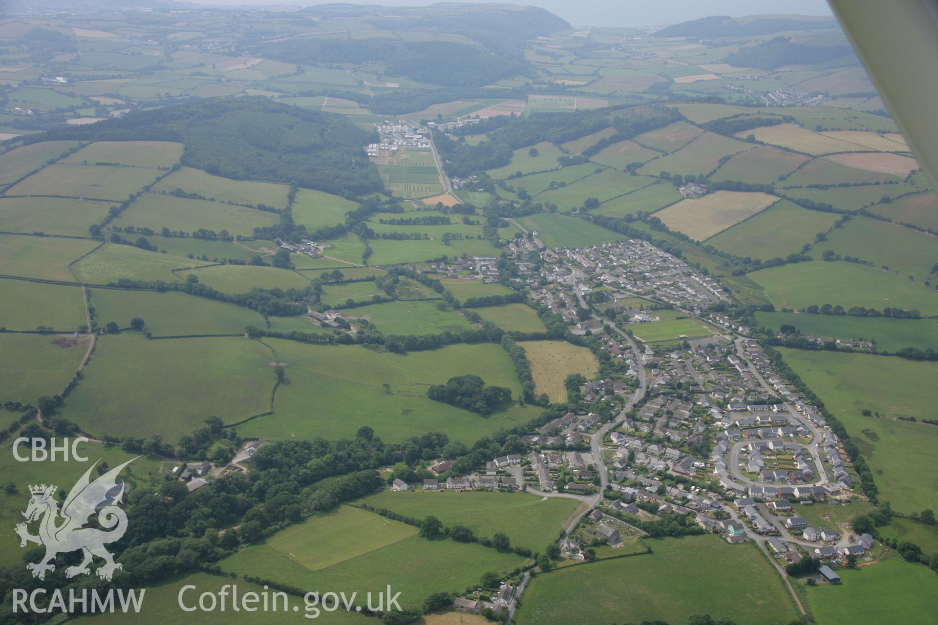 RCAHMW colour oblique aerial photograph of Penrhyncoch village and findspot. Taken on 04 July 2006 by Toby Driver