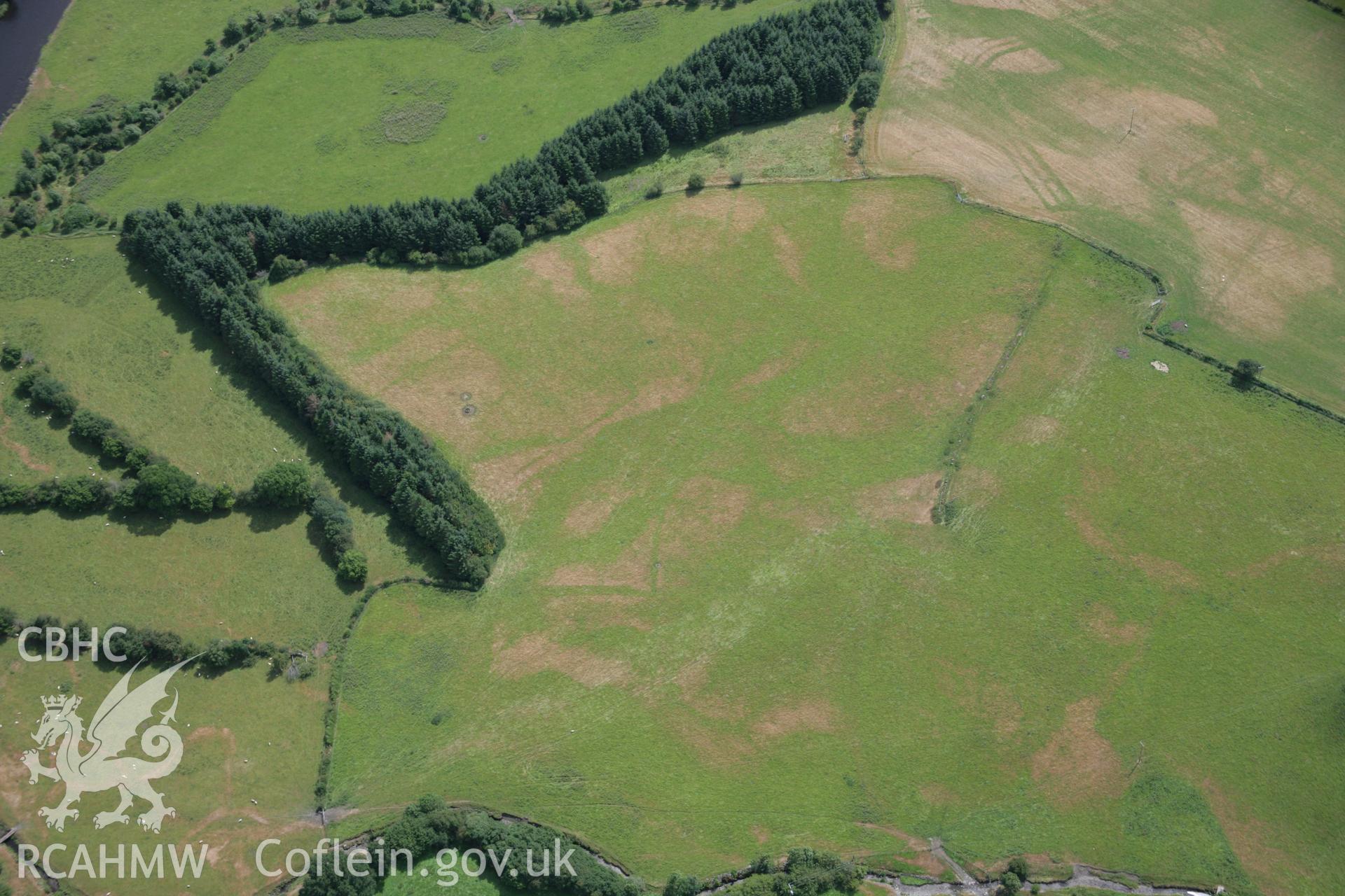RCAHMW colour oblique aerial photograph of Llanfor Roman Military Complex visible in cropmarks, viewed from the north. Taken on 31 July 2006 by Toby Driver.
