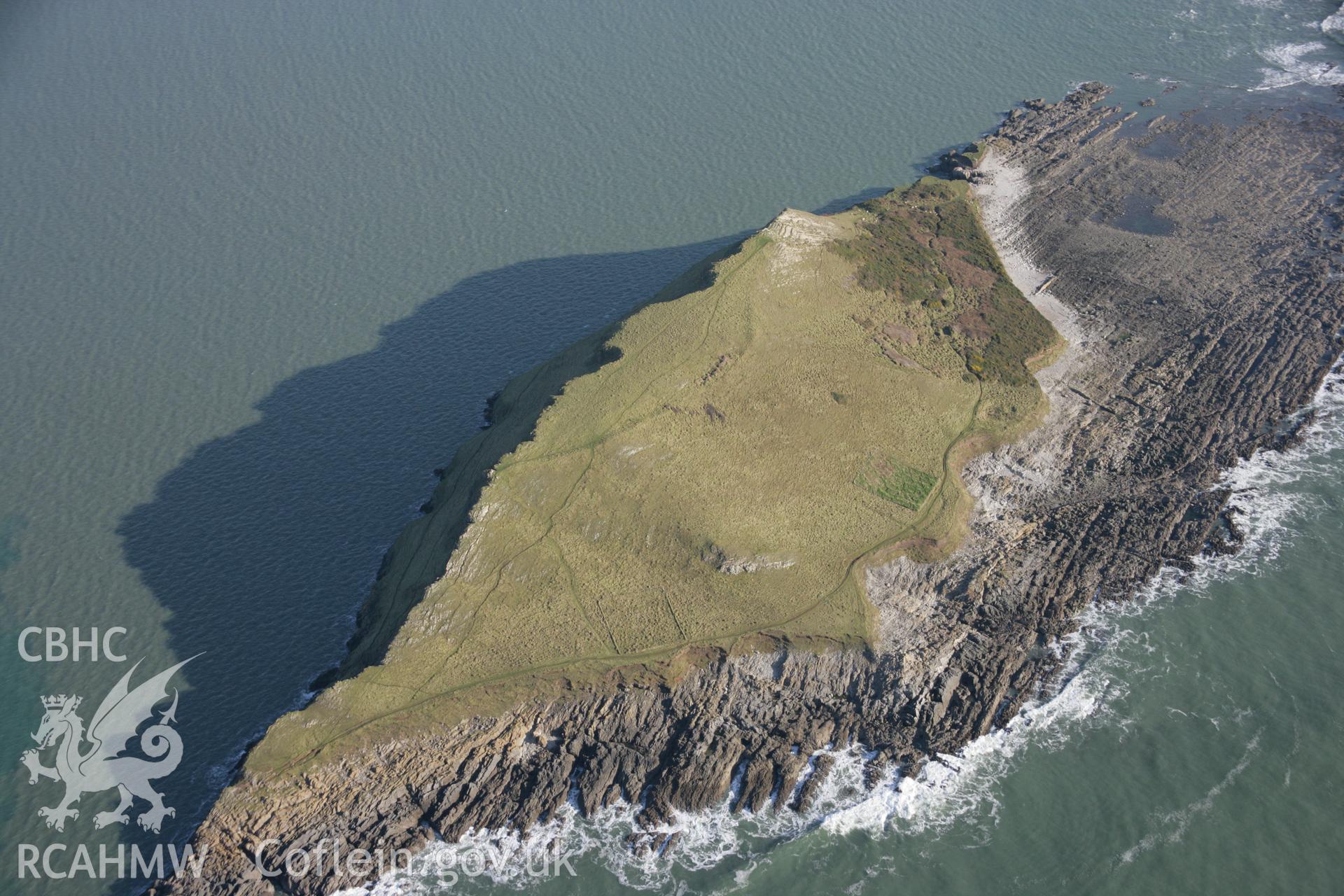 RCAHMW colour oblique aerial photograph of Worms Head Enclosure from the south-west. Taken on 26 January 2006 by Toby Driver.