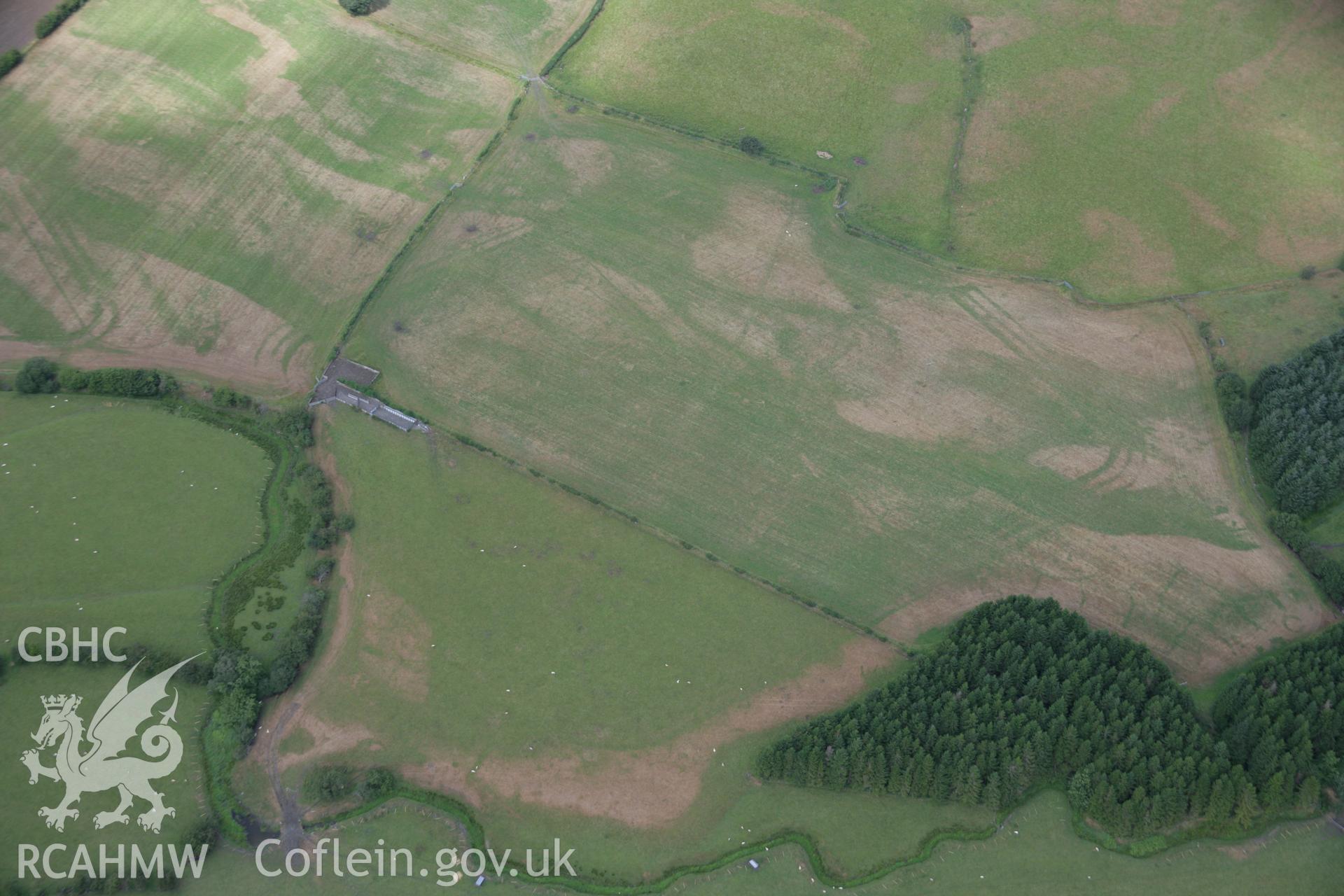 RCAHMW colour oblique aerial photograph of Llanfor Roman Military Complex visible in cropmarks, viewed from the south-east. Taken on 31 July 2006 by Toby Driver.