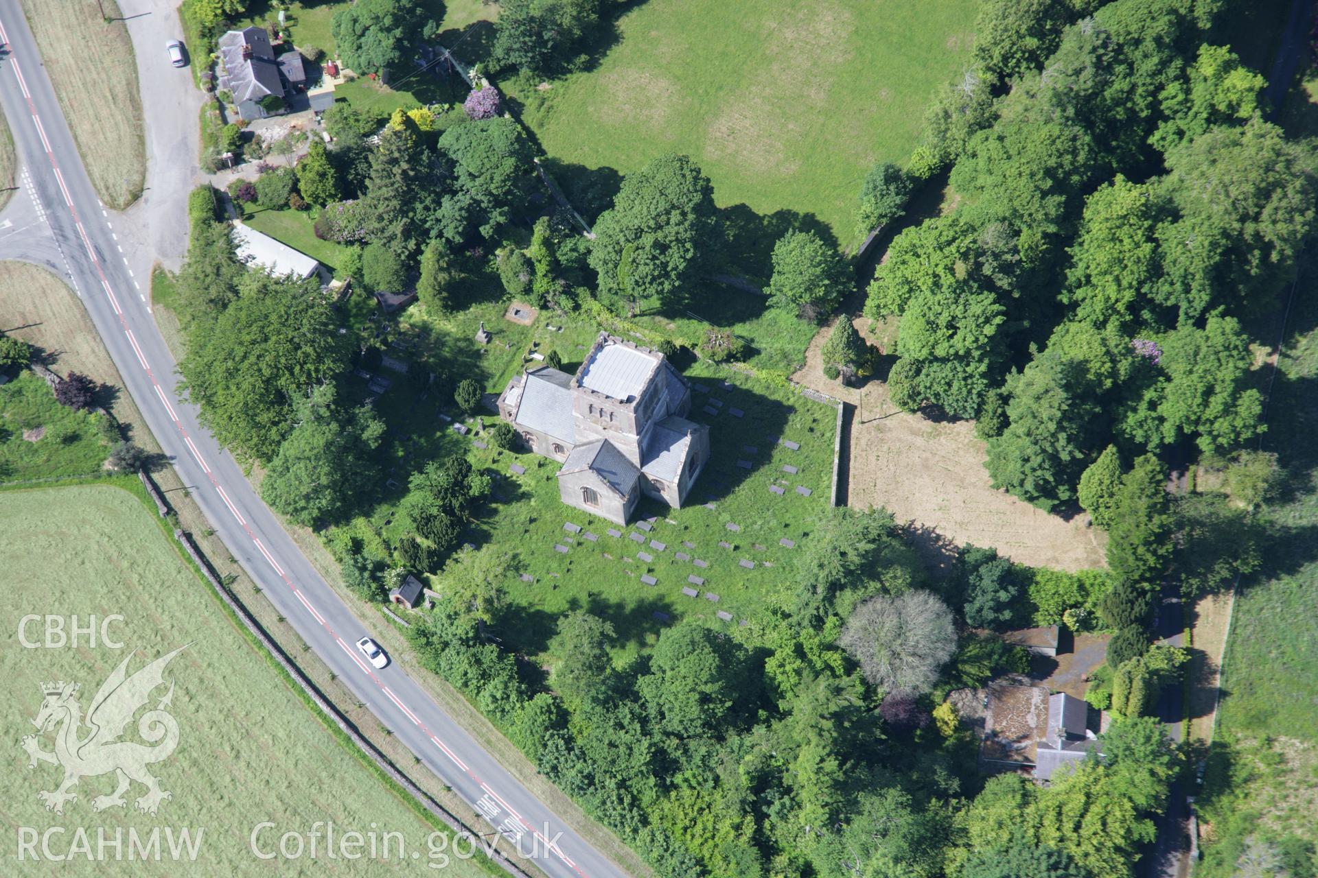 RCAHMW colour oblique aerial photograph of St Buan's Church from the south-east. Taken on 14 June 2006 by Toby Driver.