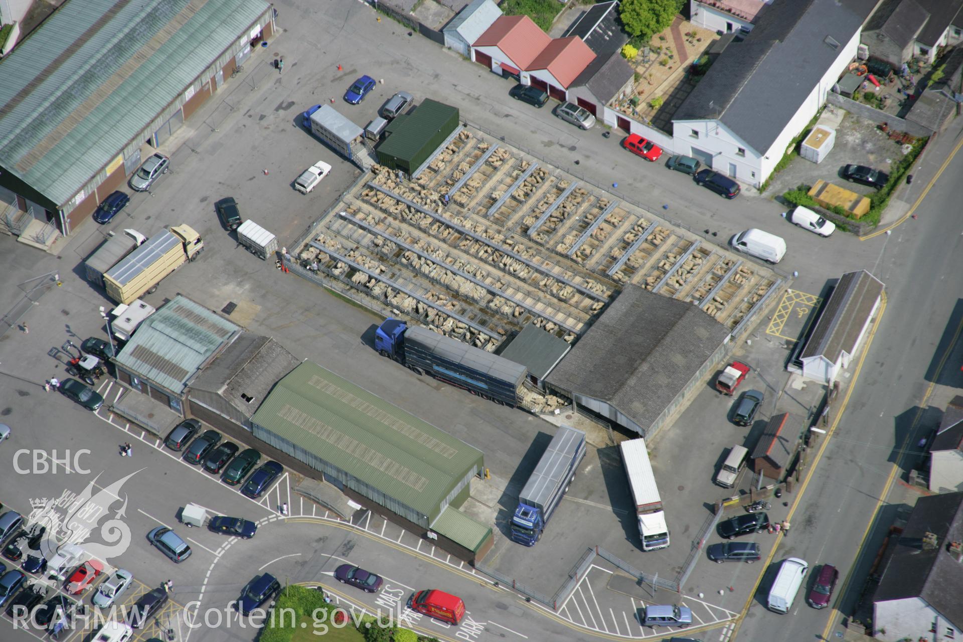 RCAHMW colour oblique aerial photograph of Newcastle Emlyn, showing view of livestock market from the south-west. Taken on 08 June 2006 by Toby Driver.