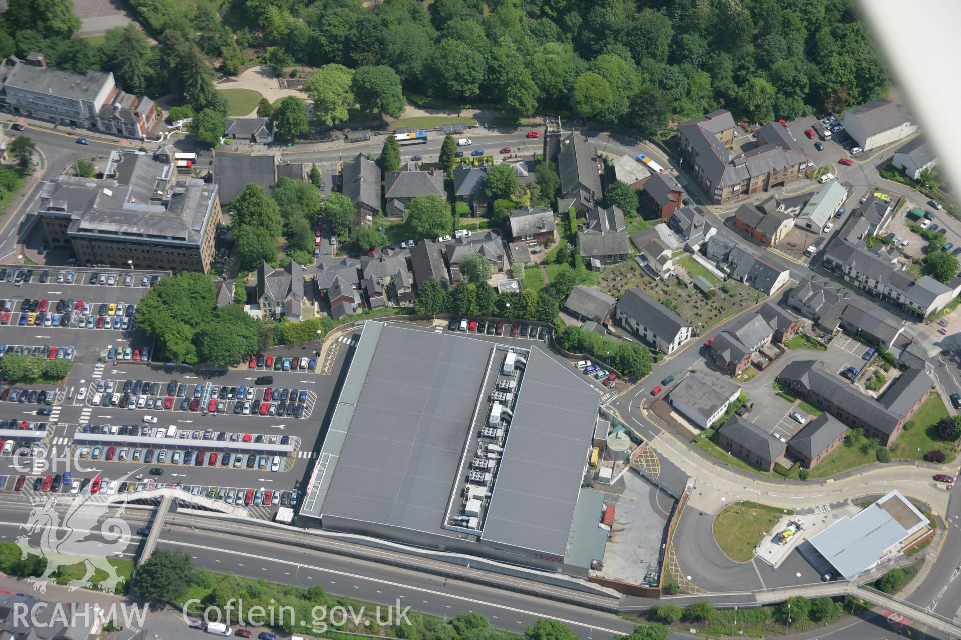 RCAHMW colour oblique aerial photograph of Pontypool from the west showing the town centre and supermarket. Taken on 09 June 2006 by Toby Driver.