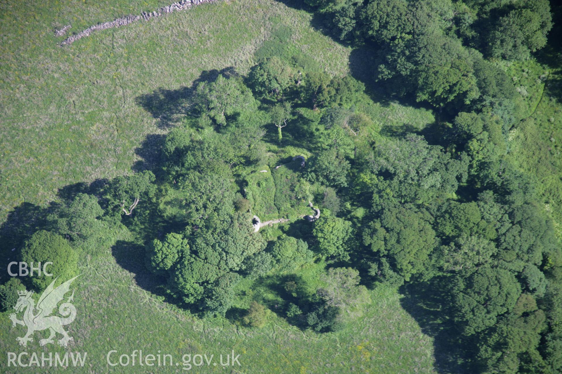 RCAHMW colour oblique aerial photograph of the castle earthworks and civil war fort at Castell Aberlleiniog, from the north-west. Taken on 14 June 2006 by Toby Driver.