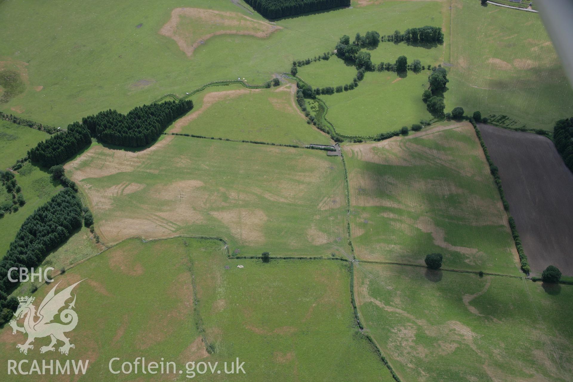 RCAHMW colour oblique aerial photograph of Llanfor Roman Military Complex visible in cropmarks, viewed from the north-east. Taken on 31 July 2006 by Toby Driver.