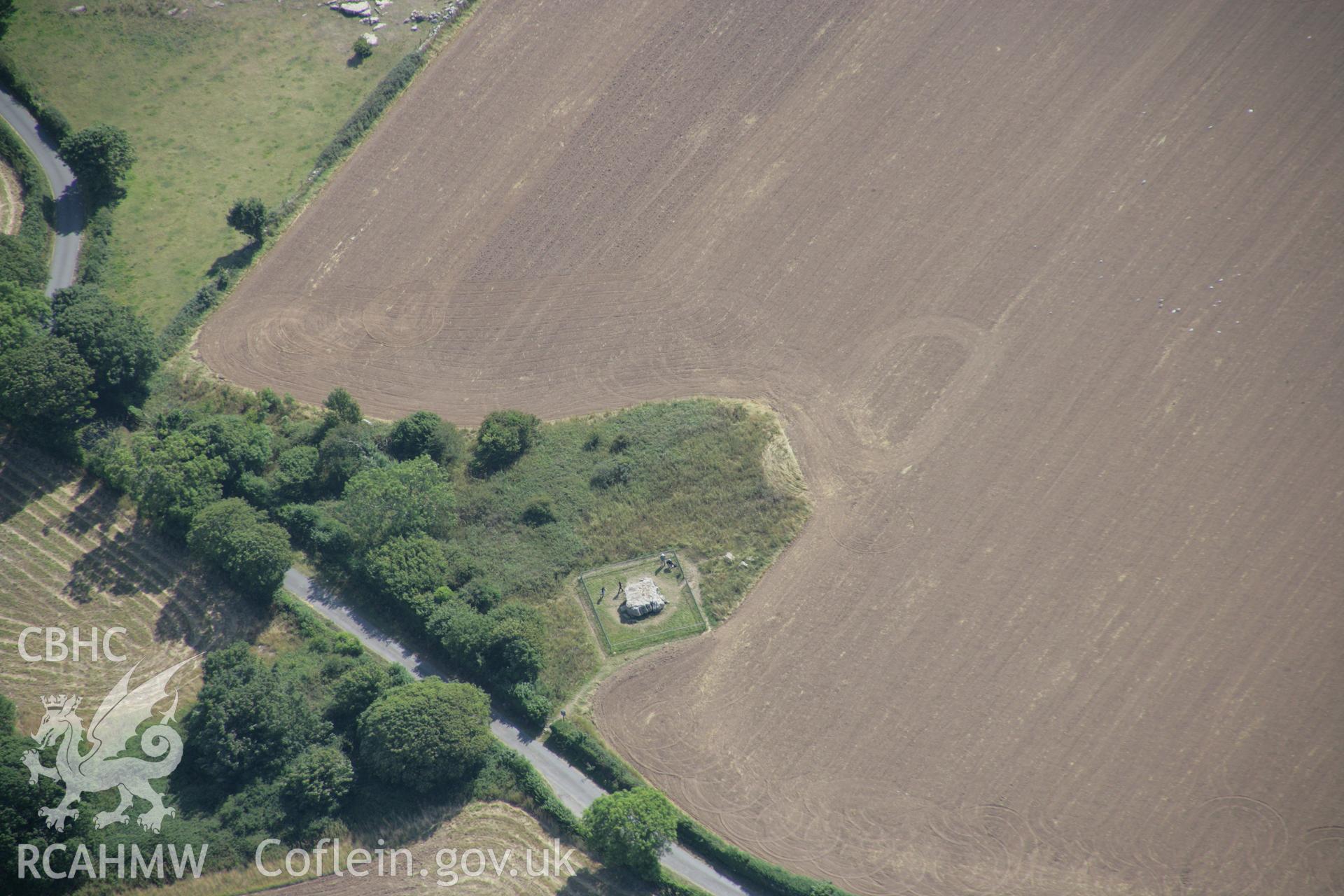 RCAHMW colour oblique aerial photograph of Lligwy Burial Chamber, near Moelfre. Taken on 14 August 2006 by Toby Driver.