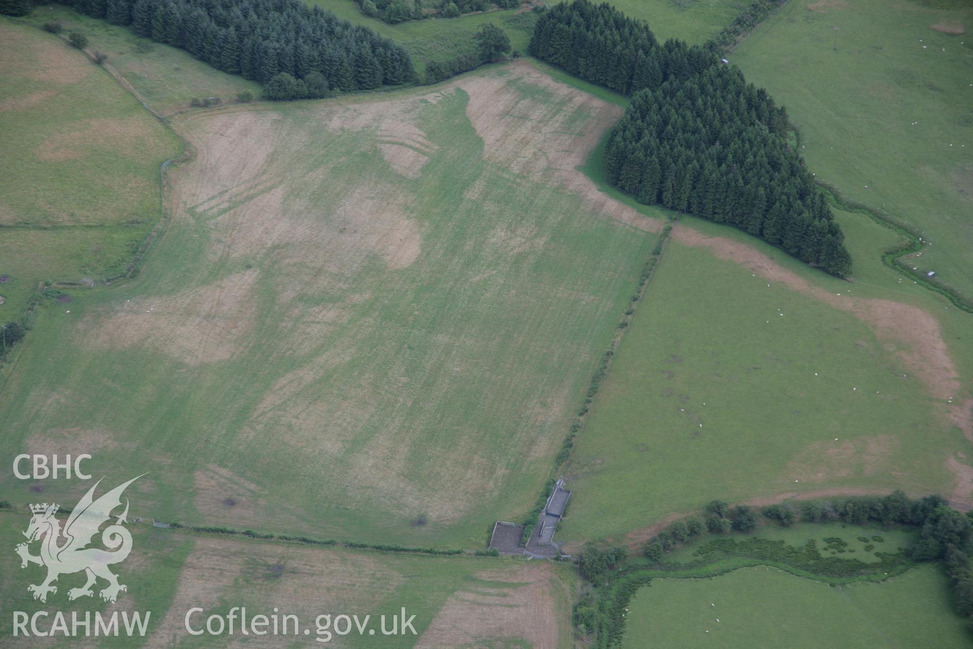 RCAHMW colour oblique aerial photograph of Llanfor Roman Military Complex visible in cropmarks, viewed from the north-west. Taken on 31 July 2006 by Toby Driver.