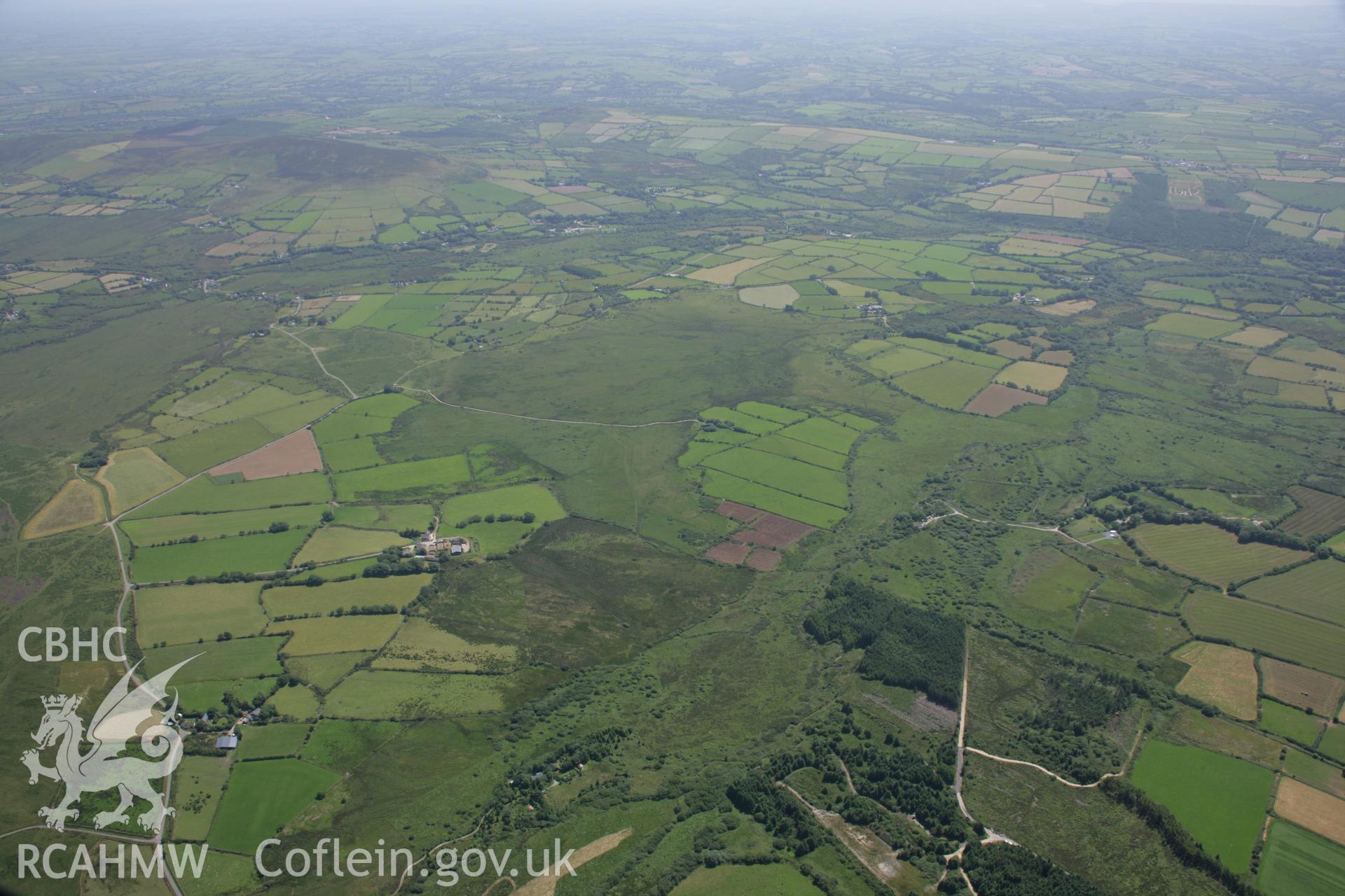 RCAHMW colour oblique aerial photograph showing landscape to the south of the Preseli Mountains. Taken on 14 July 2006 by Toby Driver