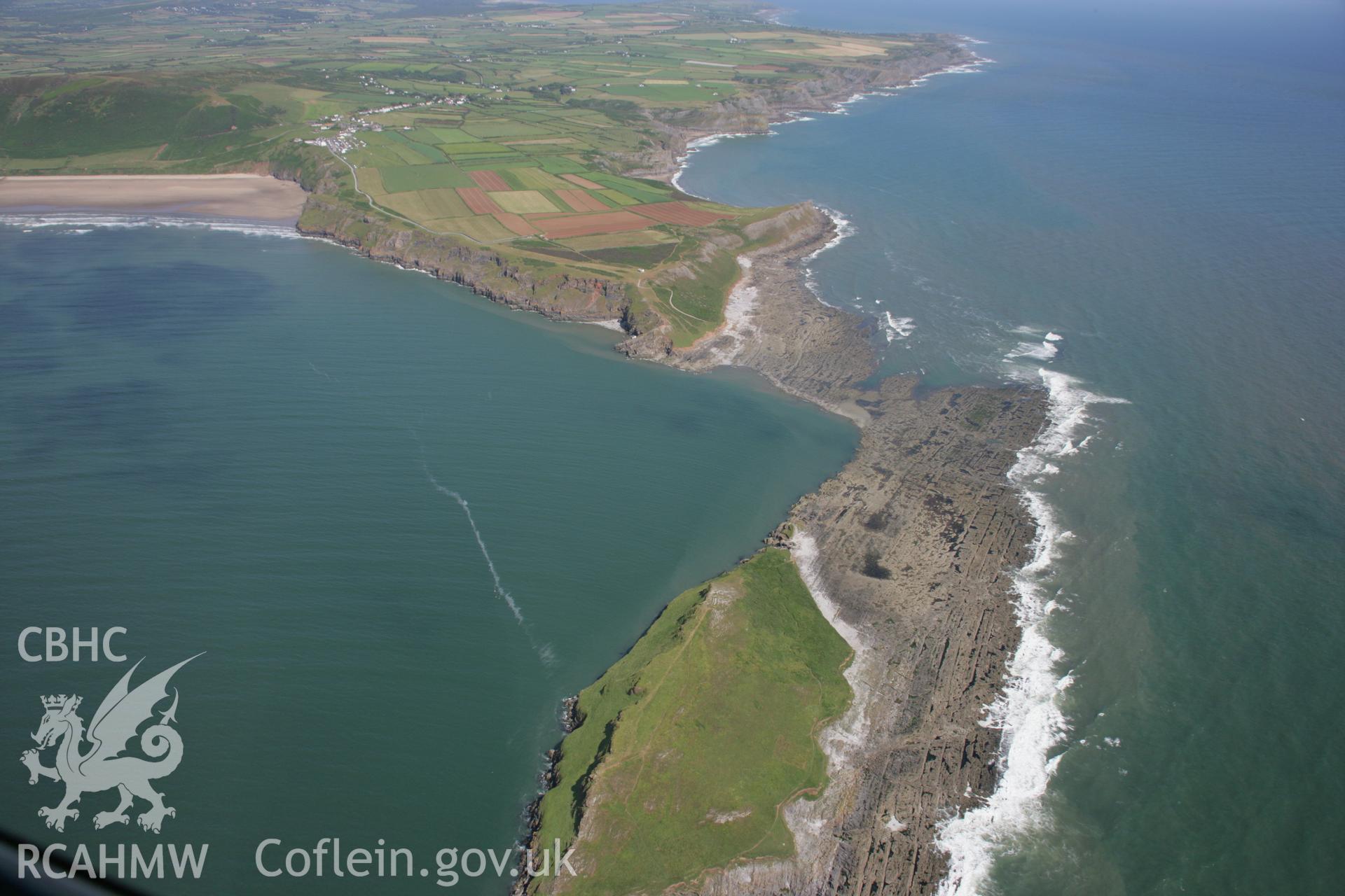 RCAHMW colour oblique aerial photograph of Worms Head and the defended enclosure. Taken on 11 July 2006 by Toby Driver.