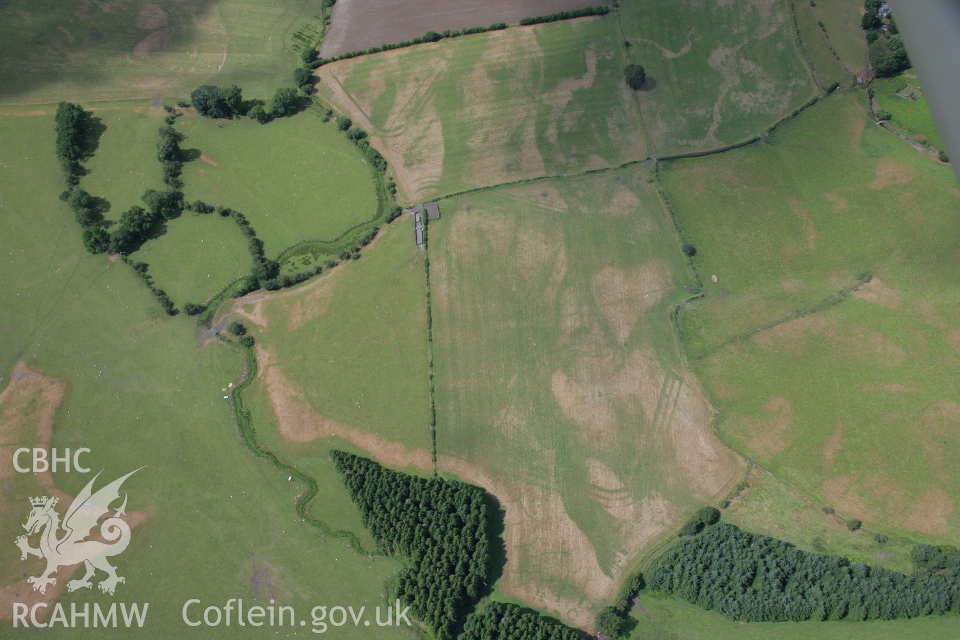 RCAHMW colour oblique aerial photograph of Llanfor Roman Military Complex visible in cropmarks, viewed from the south-east Taken on 31 July 2006 by Toby Driver.