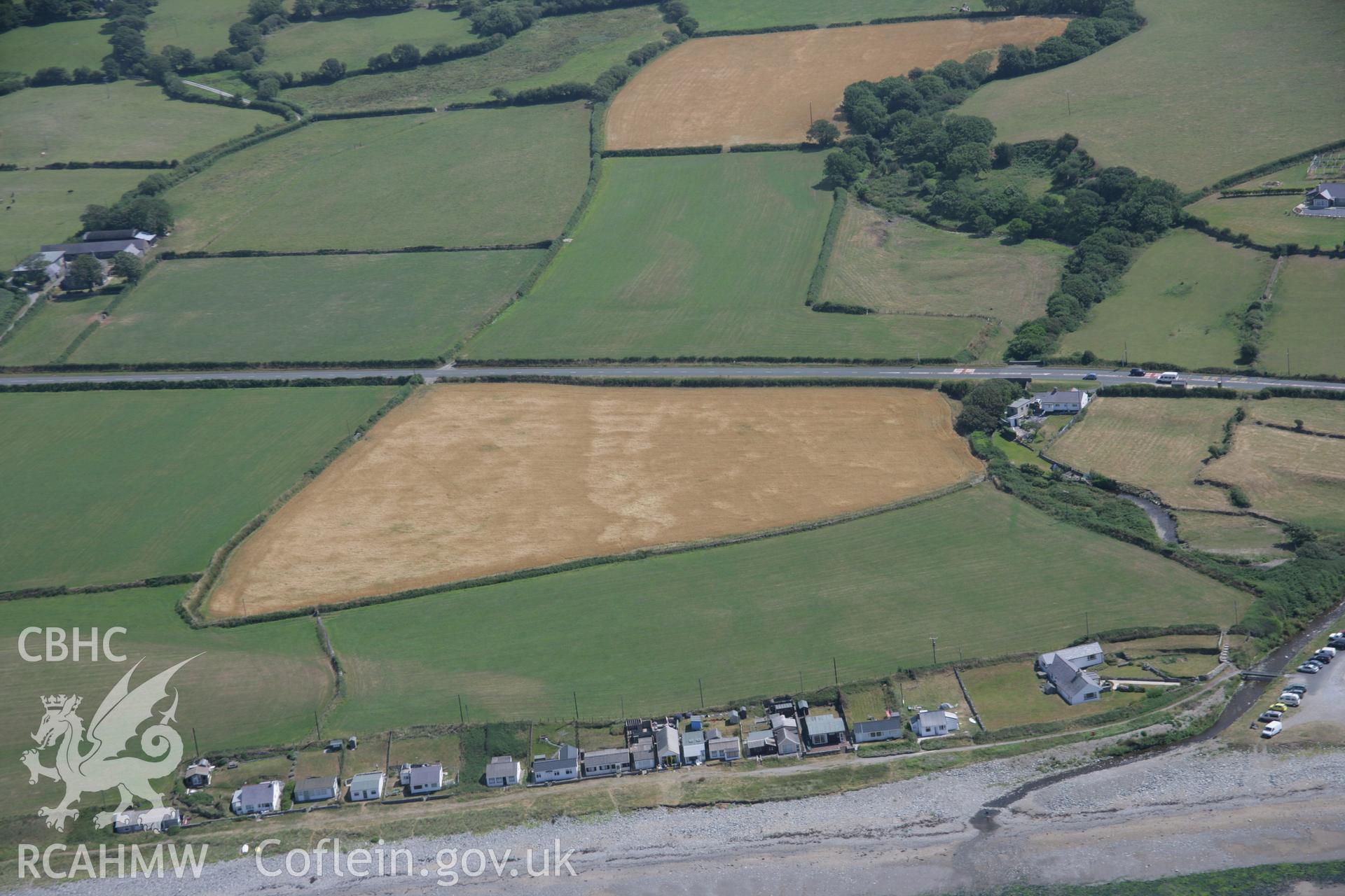 RCAHMW colour oblique aerial photograph of natural cropmarks,  Aberdesach, in general view from the west. Taken on 03 August 2006 by Toby Driver