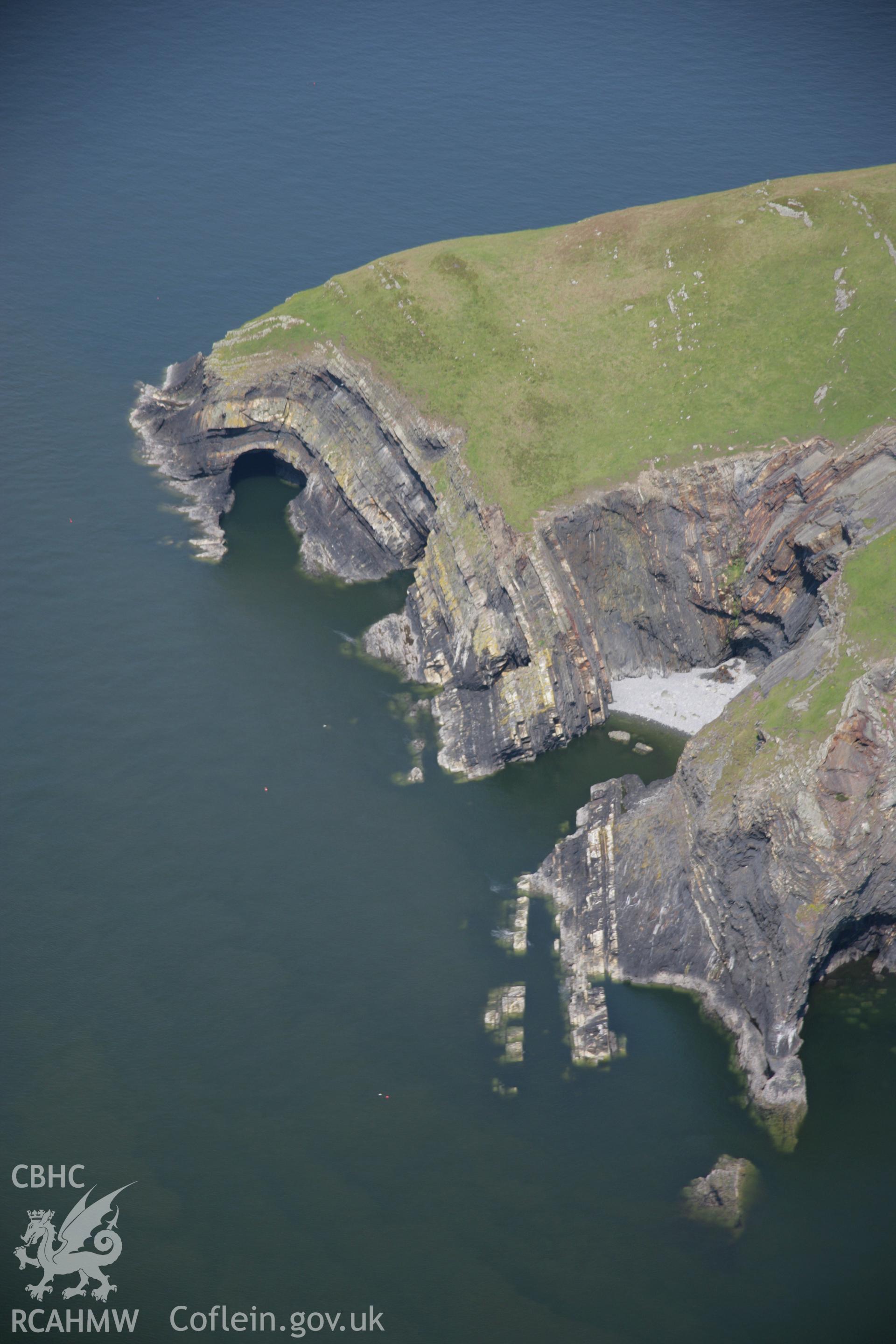 RCAHMW colour oblique aerial photograph of the Pembrokeshire Coast Path between Ceibwr Bay and Foel Hendre, from the south-west and showing the geology of the area. Taken on 08 June 2006 by Toby Driver.