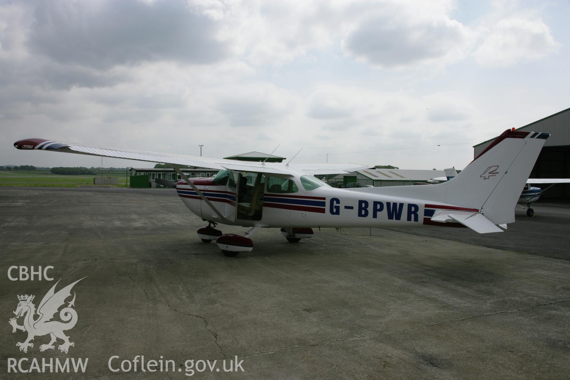 RCAHMW colour photograph of Cessna 172 outside hanger at Haverfordwest Airfield (Withybush). Taken on 15 June 2006 by Toby Driver.