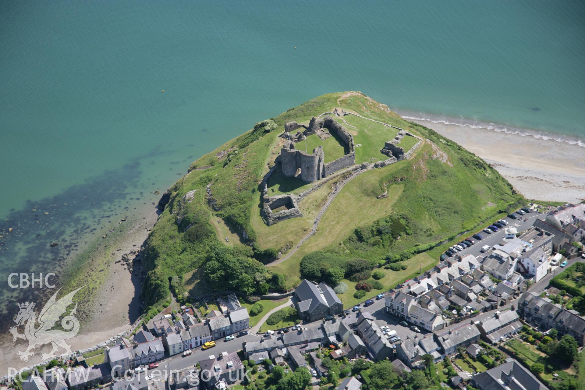 RCAHMW colour oblique aerial photograph of Criccieth Castle and the town from the north-east. Taken on 14 June 2006 by Toby Driver.