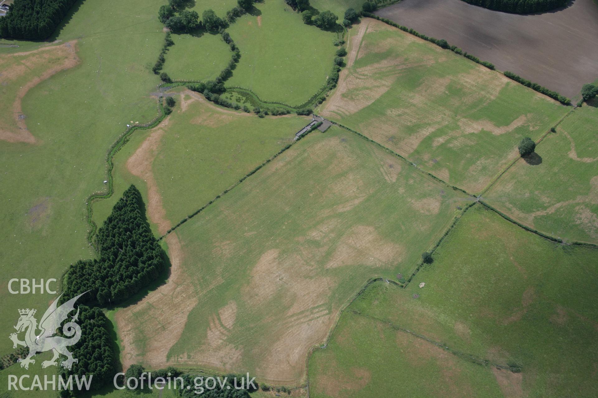 RCAHMW colour oblique aerial photograph of Llanfor Roman Military Complex visible in cropmarks, viewed from the east. Taken on 31 July 2006 by Toby Driver.