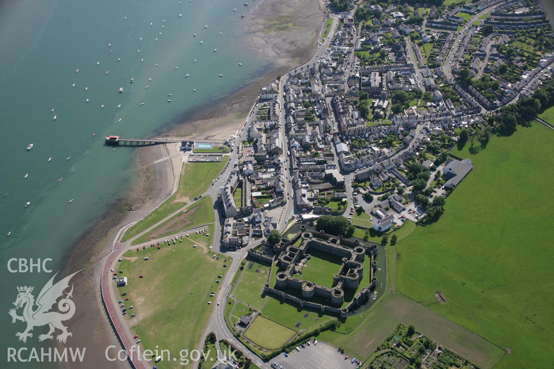 RCAHMW colour oblique aerial photograph of Beaumaris Castle and the town from the north-east. Taken on 14 June 2006 by Toby Driver.