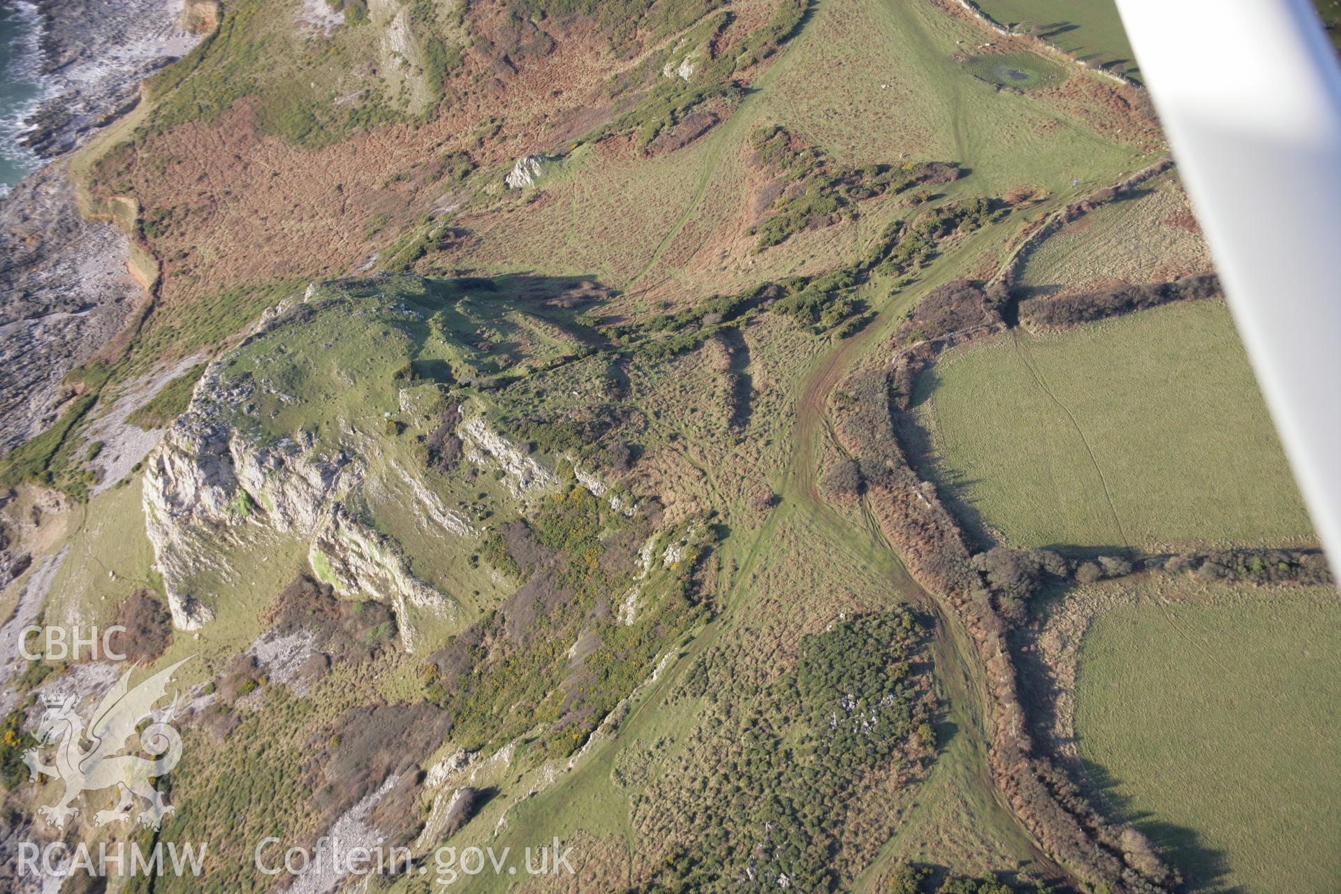 RCAHMW colour oblique aerial photograph of High Pennard Hillfort from the north-east. Taken on 26 January 2006 by Toby Driver.