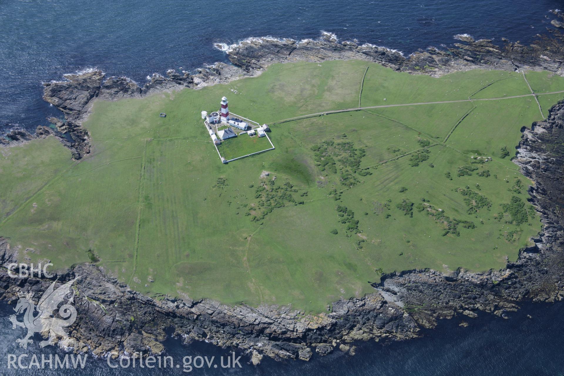 RCAHMW colour oblique aerial photograph of Bardsey Island Lighthouse from the east. Taken on 14 June 2006 by Toby Driver.
