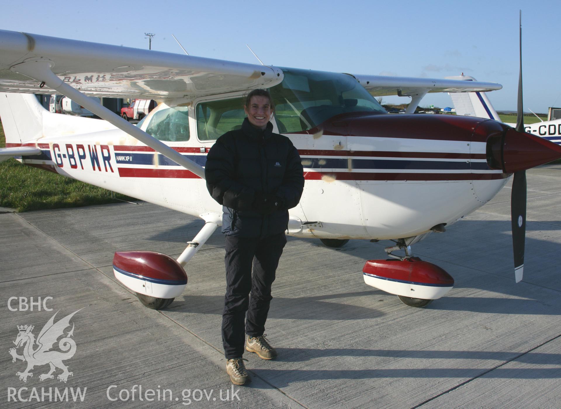 RCAHMW colour photograph of Louise Barker and Cessna 172 post-flight at Haverfordwest Airfield (Withybush). Taken on 11 January 2006 by Toby Driver.