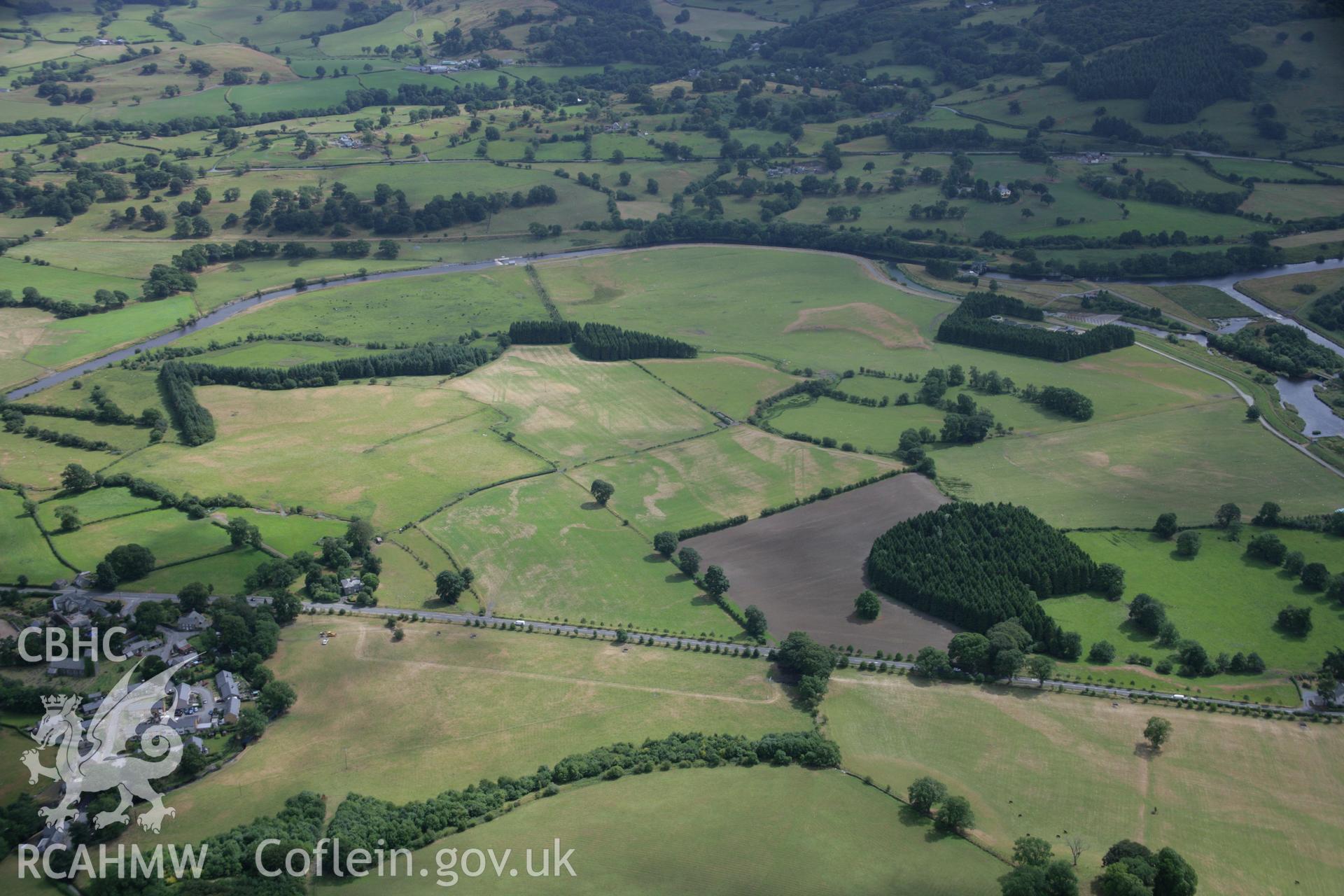RCAHMW colour oblique aerial photograph of Llanfor Roman Military Complex visible in cropmarks, in general view from the north. Taken on 31 July 2006 by Toby Driver.