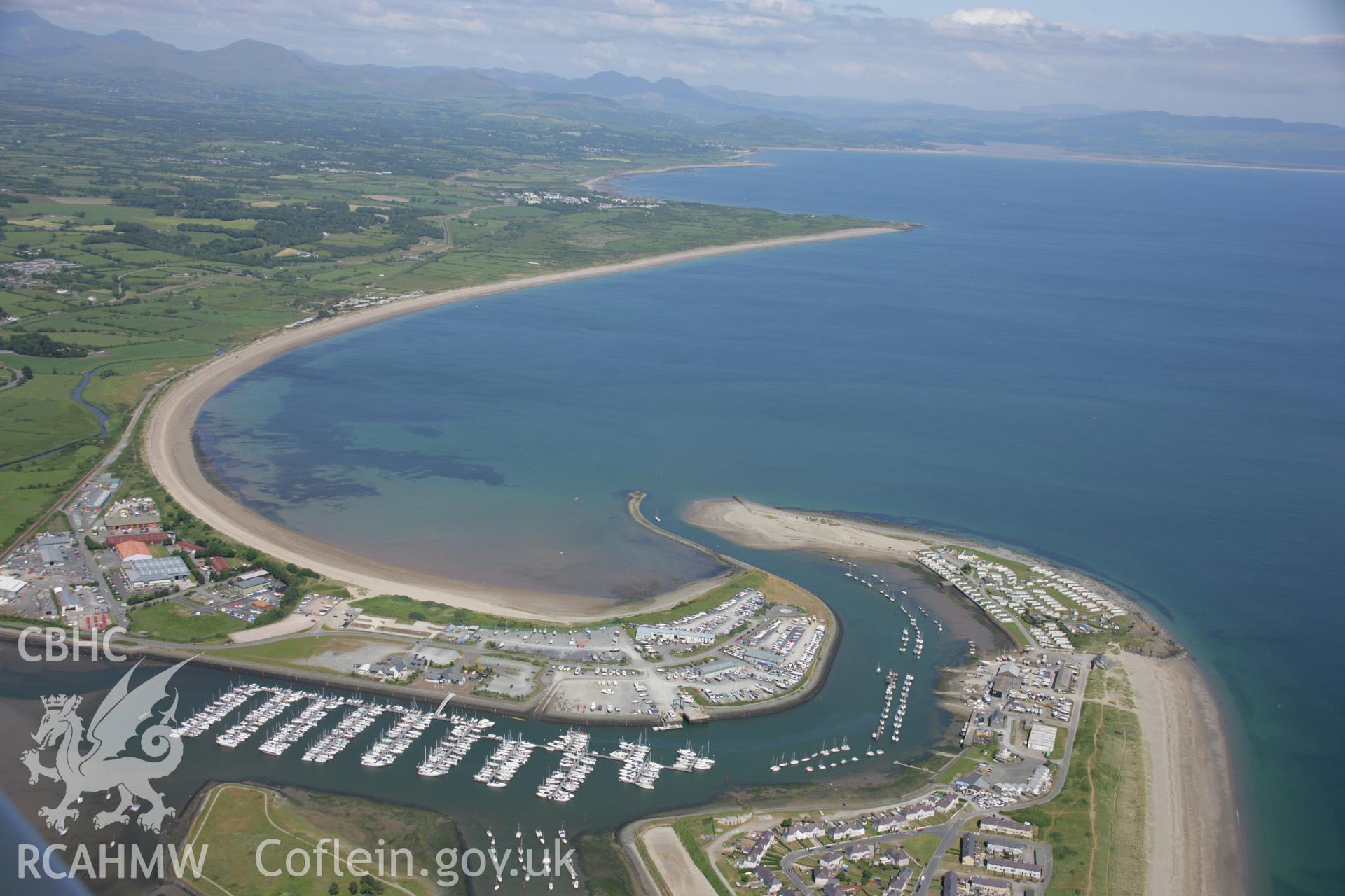 RCAHMW colour oblique aerial photograph of Pwllheli Harbour. A wide landscape view looking east. Taken on 14 June 2006 by Toby Driver.