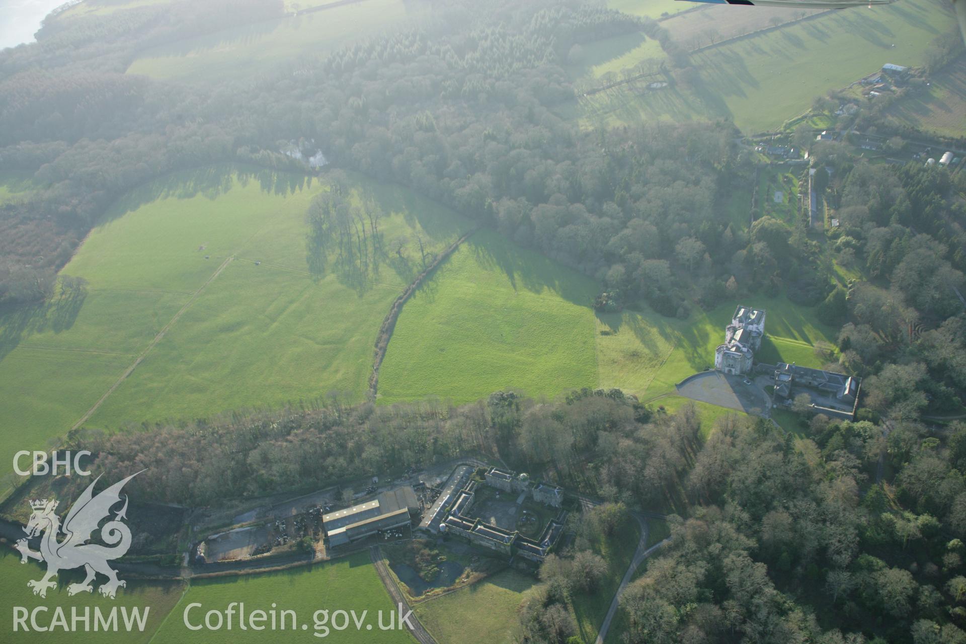 RCAHMW colour oblique aerial photograph of Picton Castle Garden, Slebech, showing earthworks in the parkland to the south. Taken on 26 January 2006 by Toby Driver.