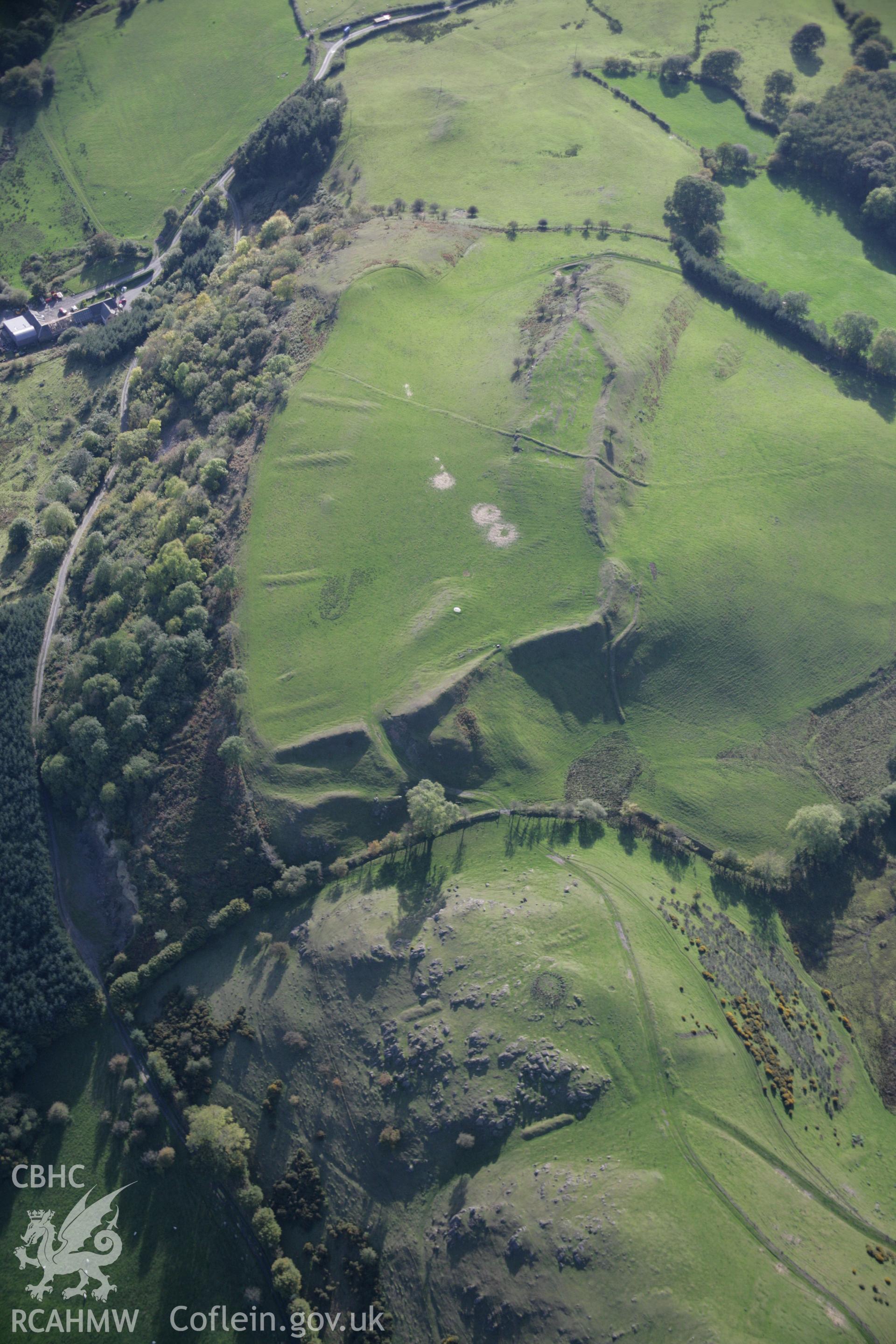 RCAHMW colour oblique aerial photograph of Graig Fawr Camp from the north with pillow mounds visible. Taken on 13 October 2005 by Toby Driver