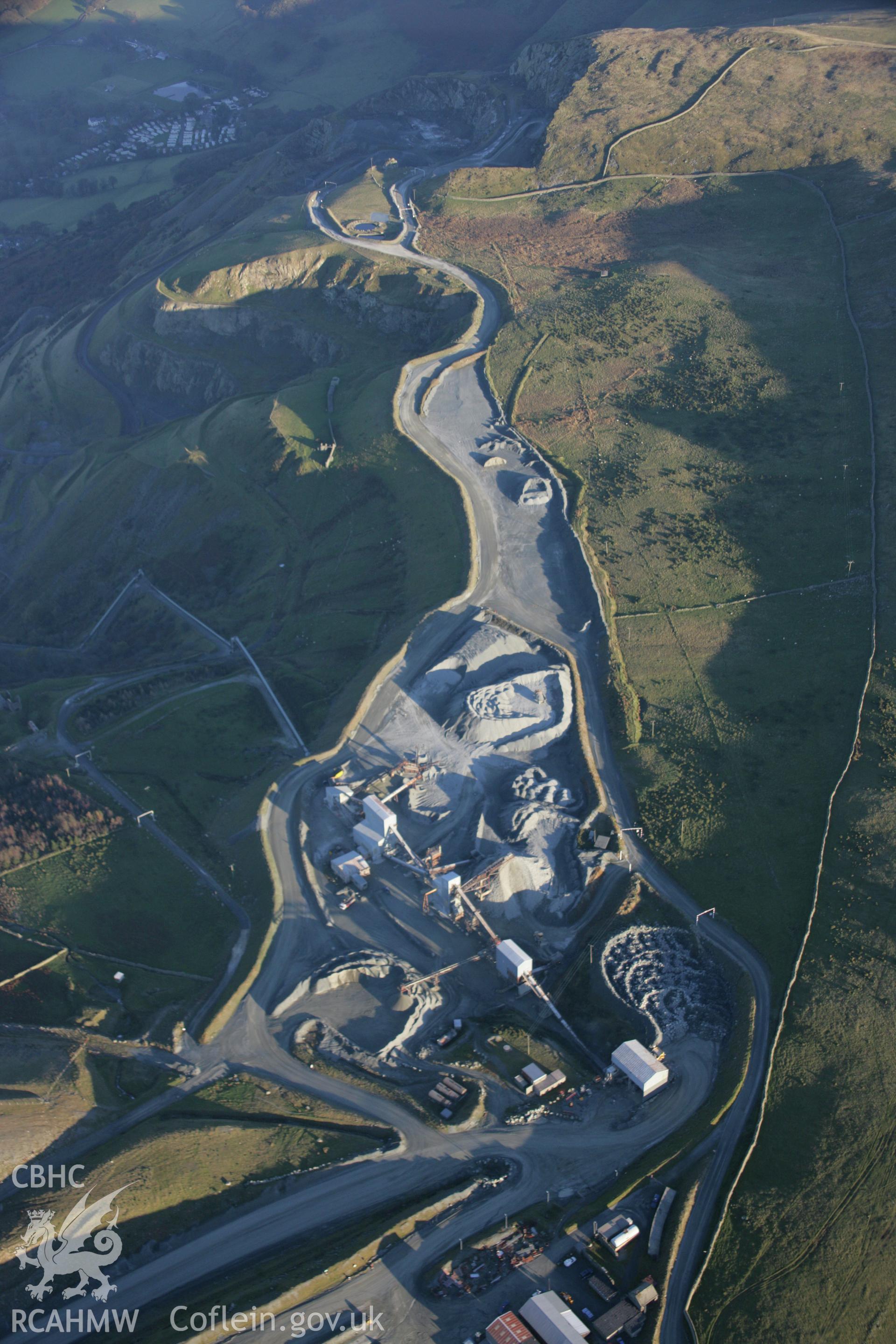 RCAHMW colour oblique aerial photograph of Penmaenmawr Stone Quarry, viewed from the west. Taken on 21 November 2005 by Toby Driver