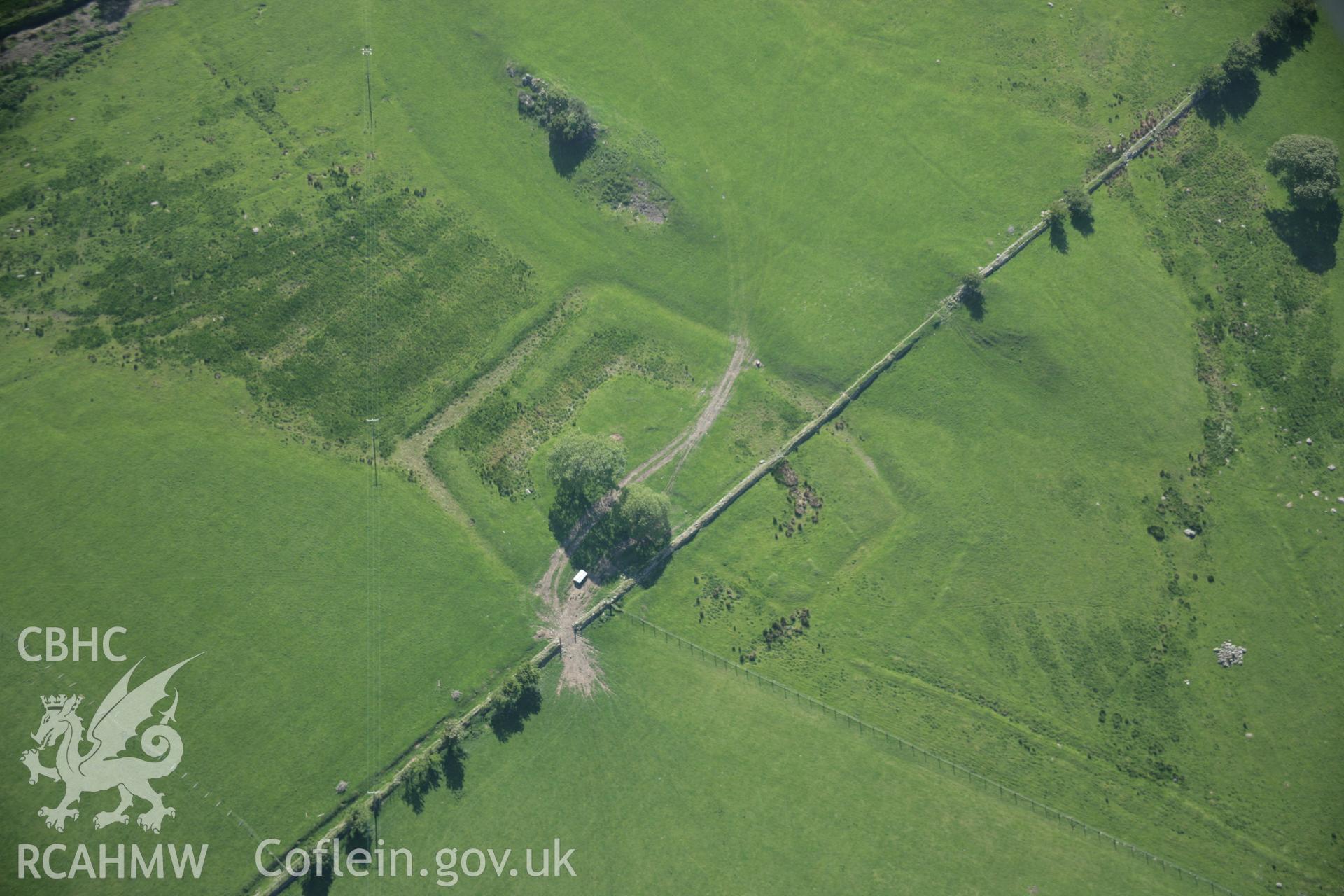 RCAHMW digital colour oblique photograph of a rectangular earthwork near Coed y Mawr viewed from the east. Taken on 08/06/2005 by T.G. Driver.