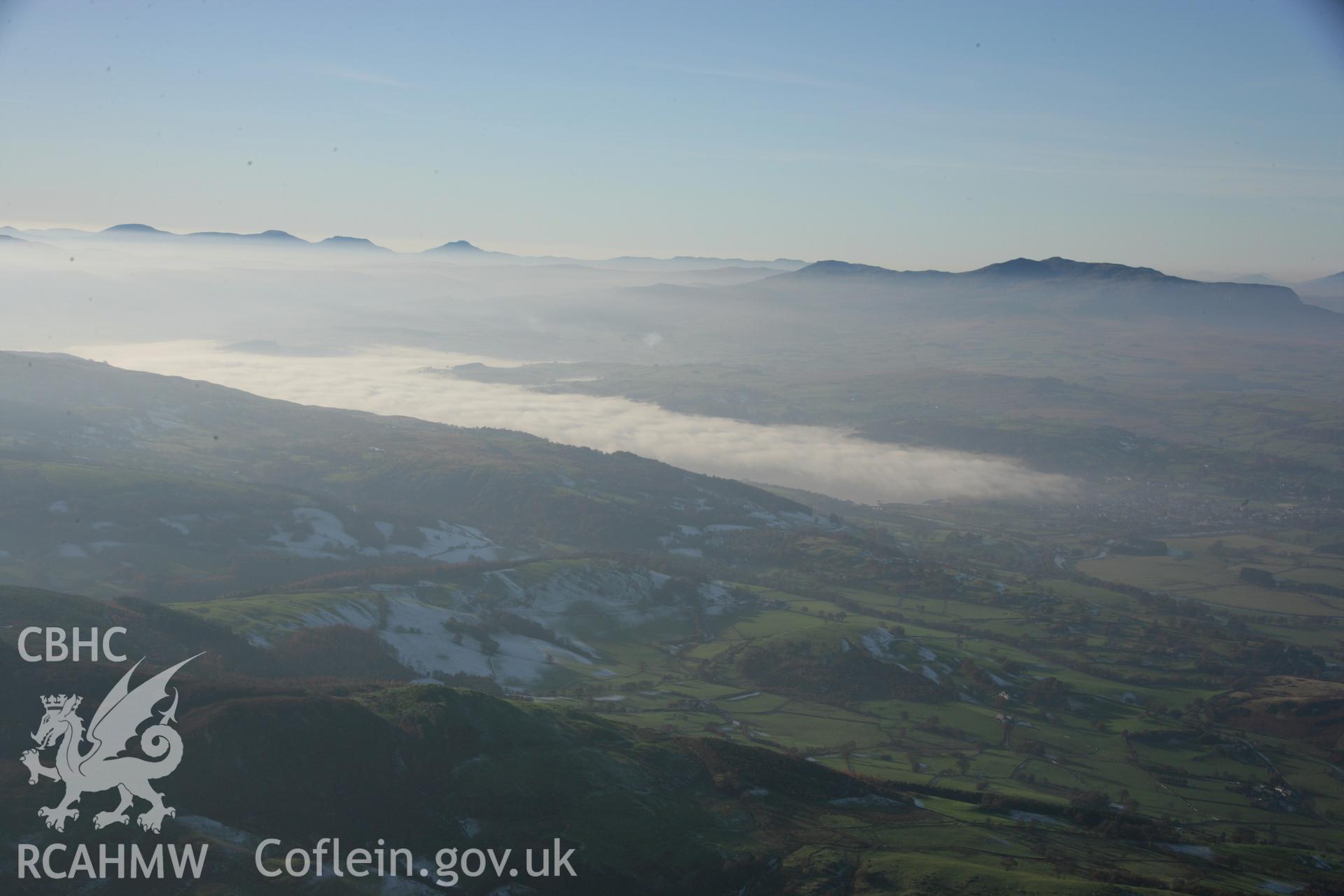 RCAHMW colour oblique aerial photograph of Llyn Tegid (Bala Lake) in winter landscape with mist infilling lake, looking west. Dust specks are visible from the digital sensor. Taken on 21 November 2005 by Toby Driver