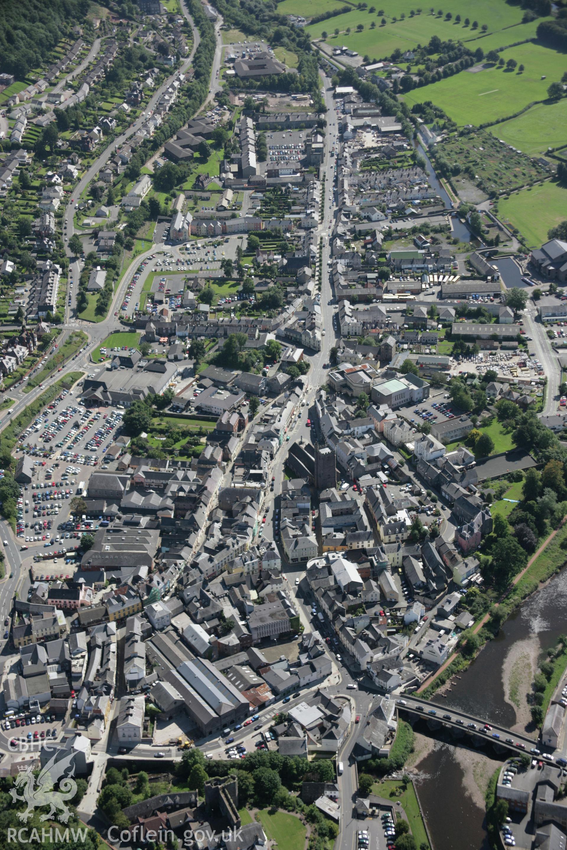 RCAHMW colour oblique aerial photograph of Brecon. A high view of the town centre looking south-east. Taken on 02 September 2005 by Toby Driver