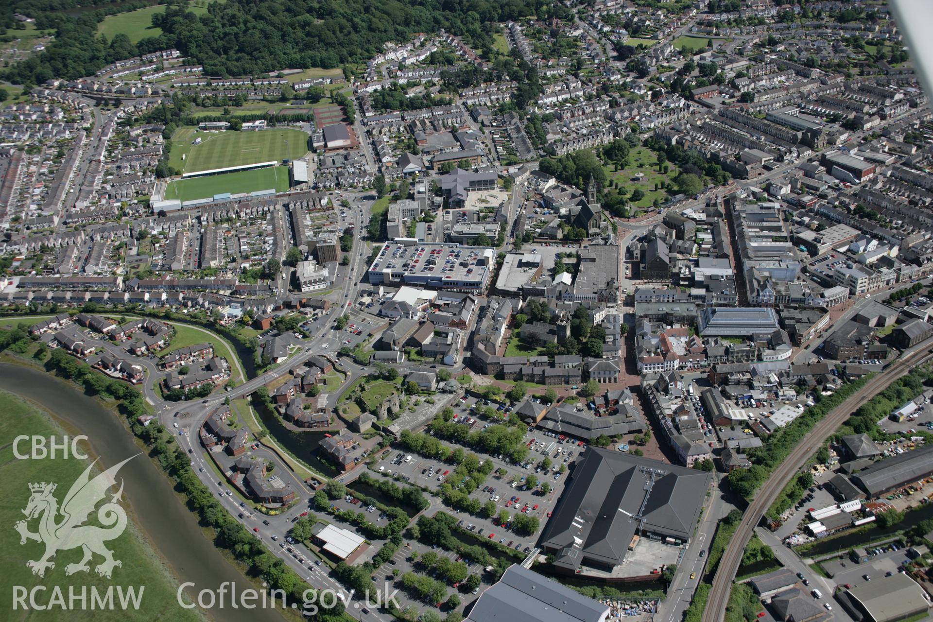 RCAHMW colour oblique aerial photograph of Neath Castle and town, viewed from the north-west. Taken on 22 June 2005 by Toby Driver