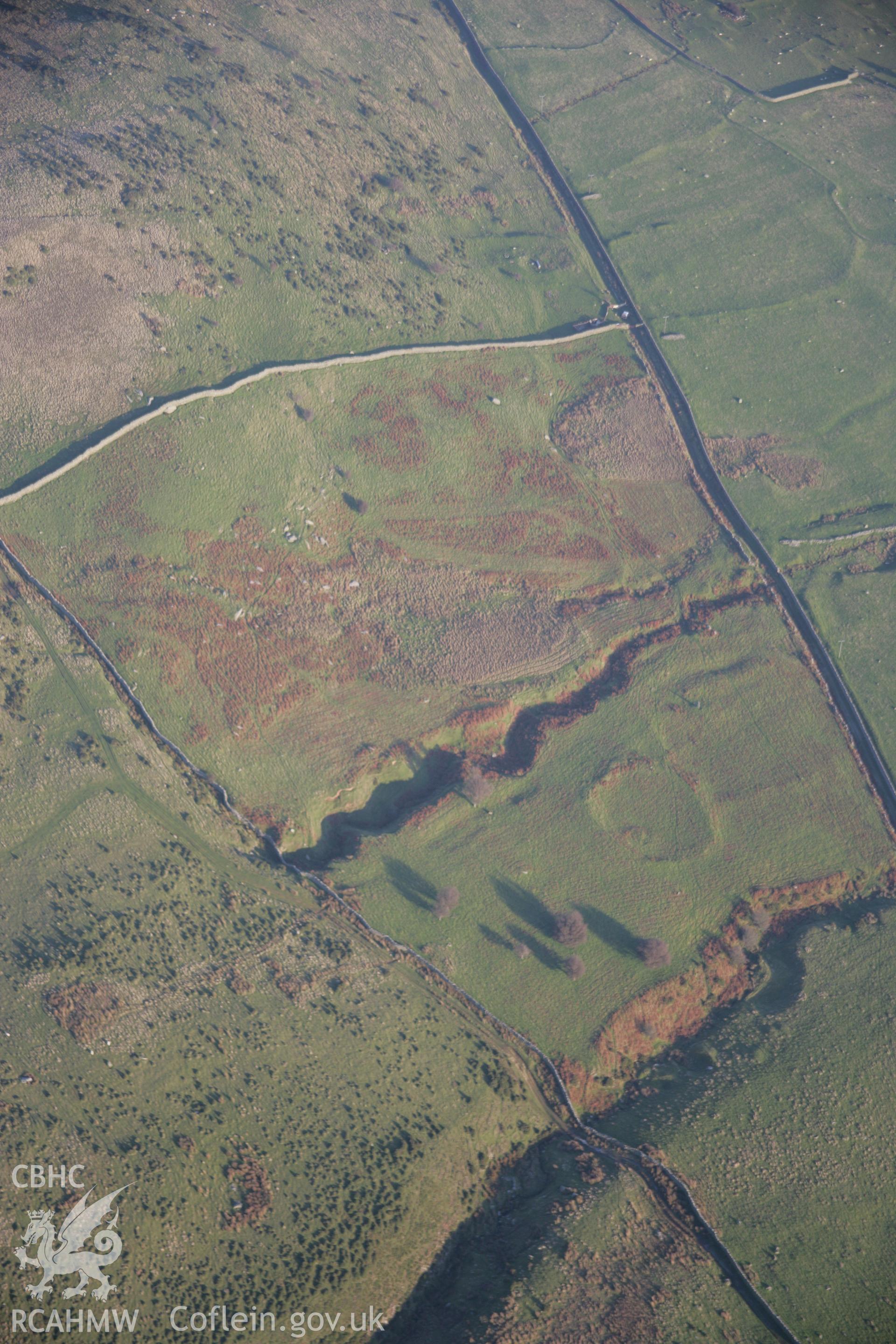 RCAHMW colour oblique aerial photograph of a homestead near Maen-y-Bardd viewed from the west. Taken on 21 November 2005 by Toby Driver