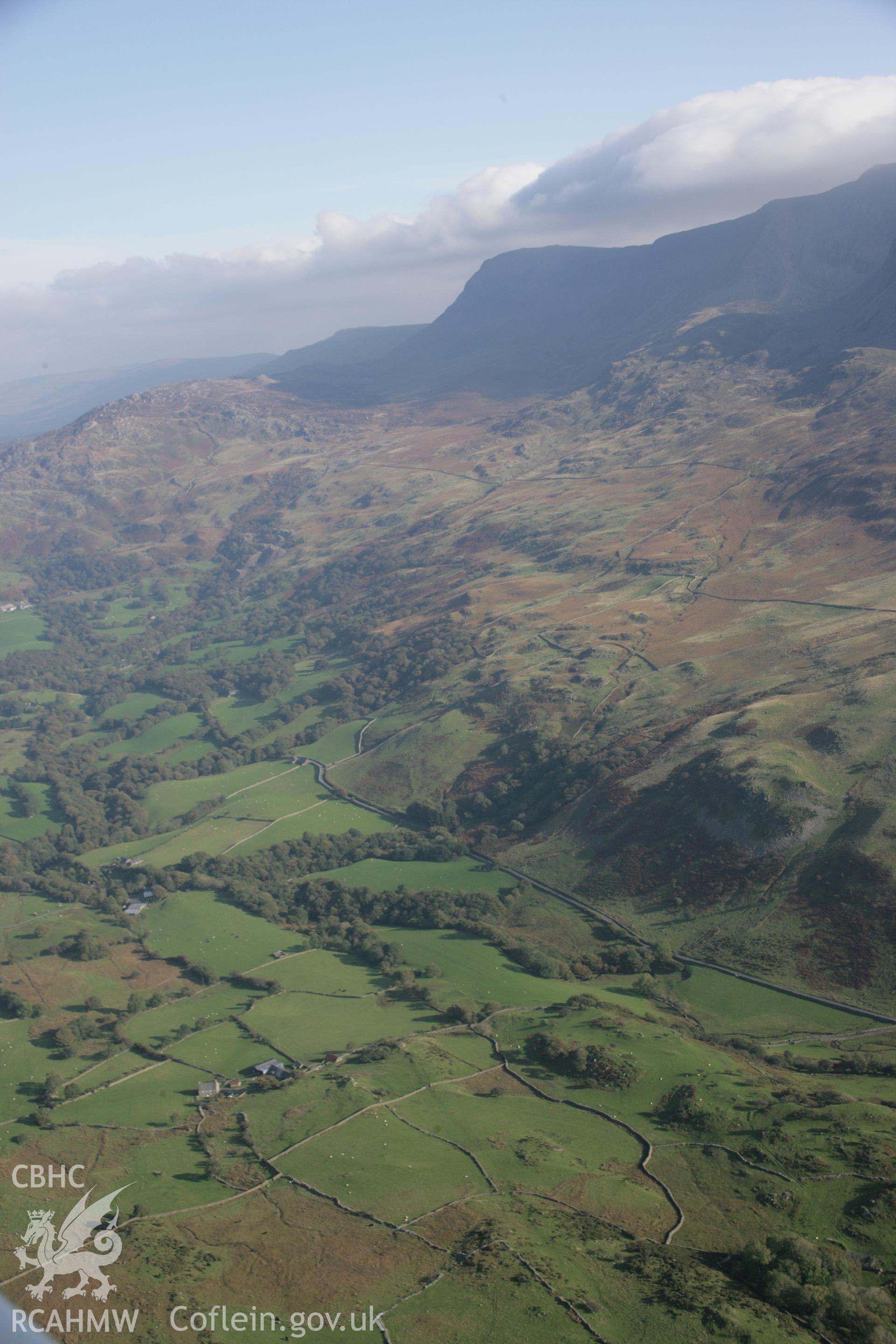 RCAHMW colour oblique aerial photograph of the landscape near Islawr-dref with Cadair Idris beyond. Taken on 17 October 2005 by Toby Driver