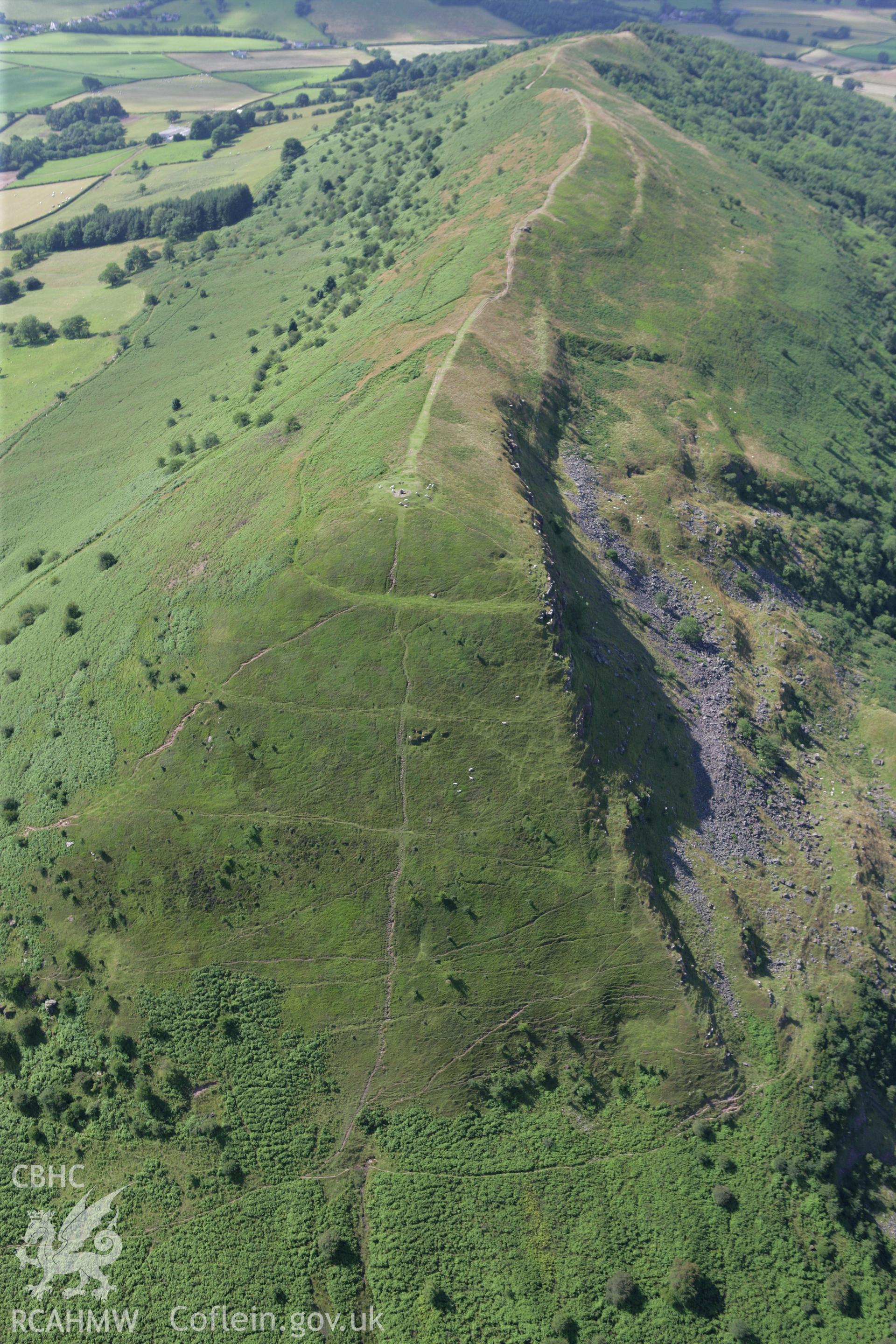 RCAHMW colour oblique photograph of Skirrid Fawr, remains of St Michael's Chapel and Skirrid Fawr Summit Enclosure, from the north. Taken by Toby Driver on 21/07/2008.