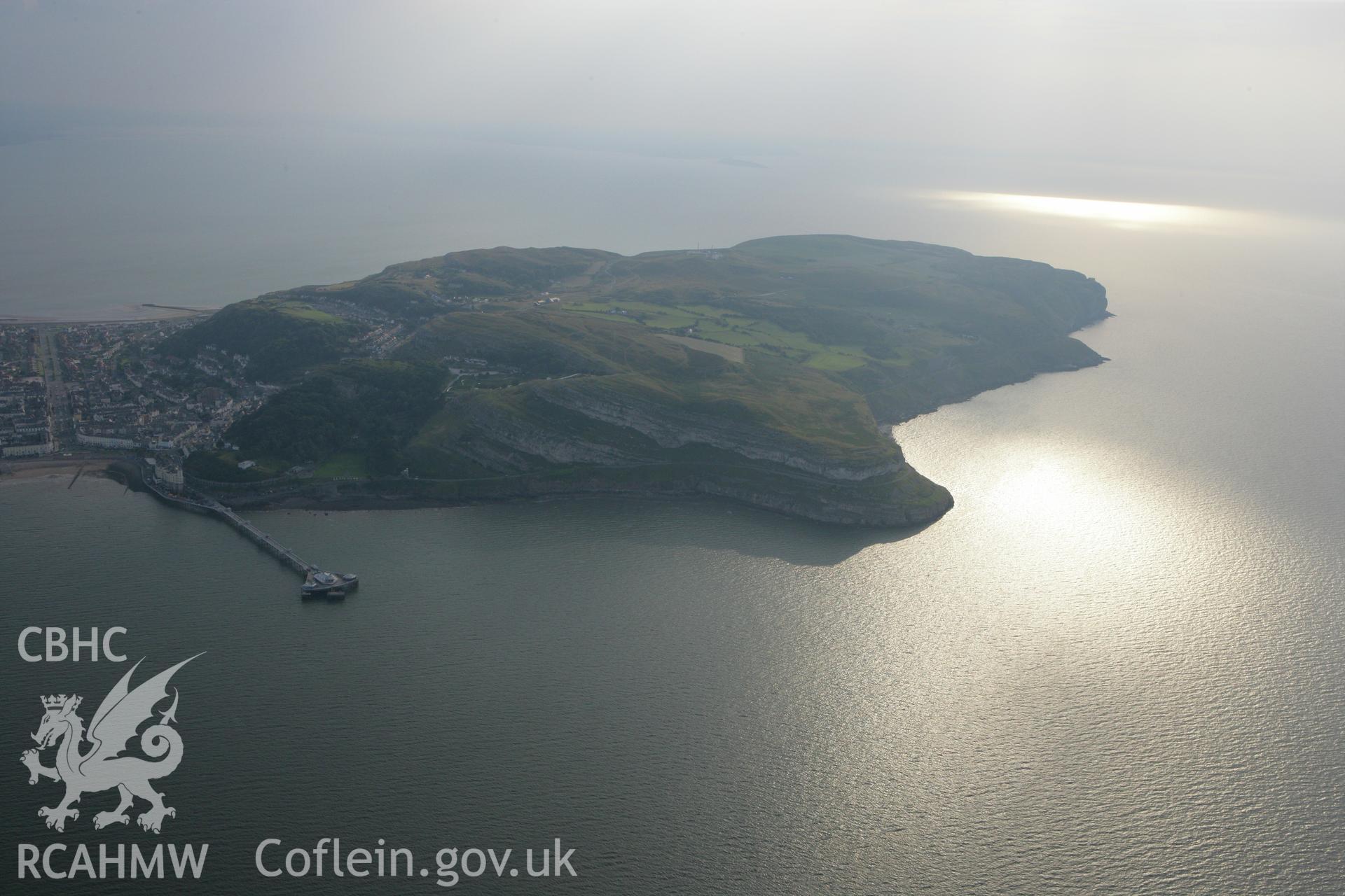 RCAHMW colour oblique photograph of Great Orme's Head, with Llandudno Pier, view from the east. Taken by Toby Driver on 24/07/2008.