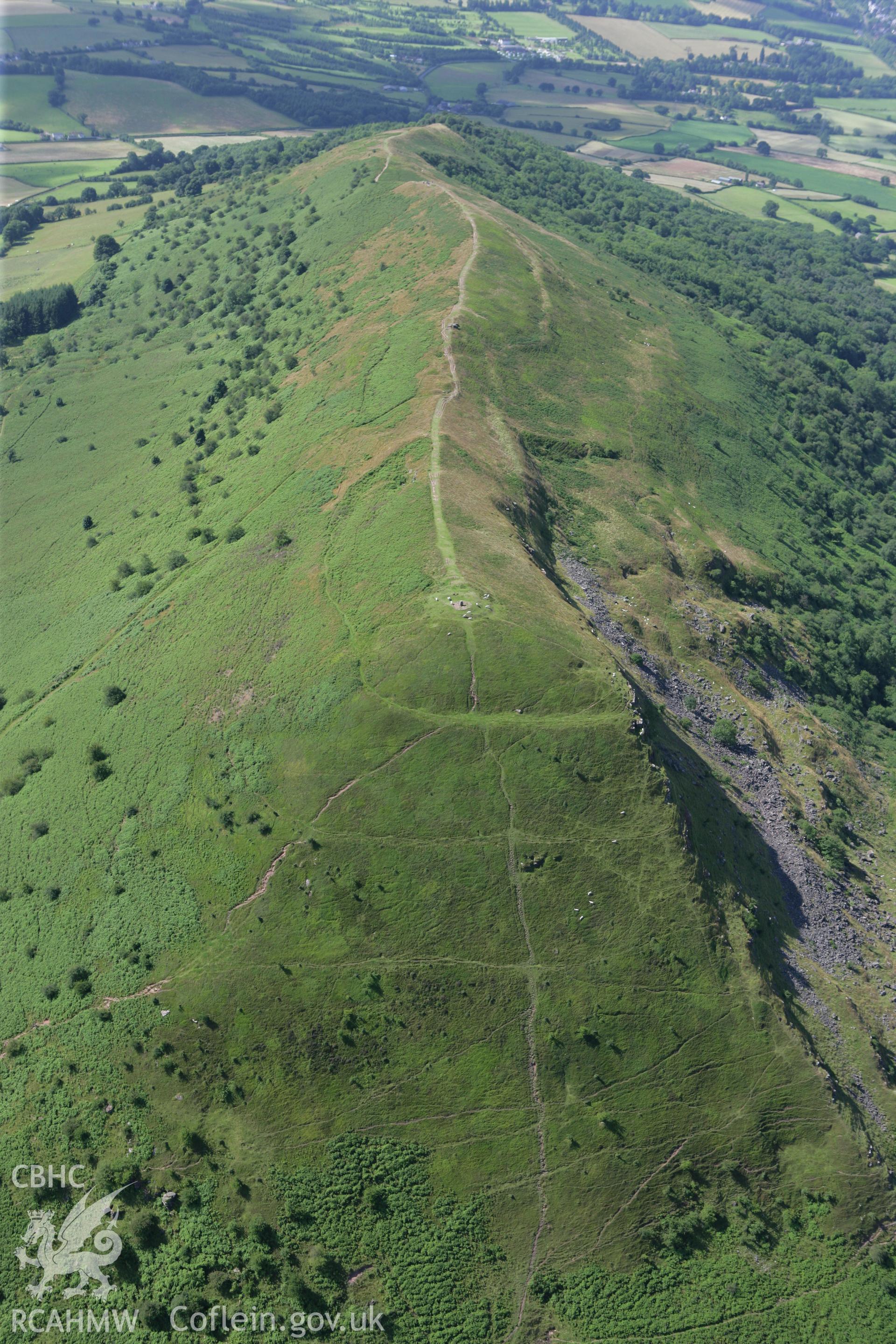 RCAHMW colour oblique photograph of Skirrid Fawr, remains of St Michael's Chapel and Skirrid Fawr Defended Enclosure, from the north. Taken by Toby Driver on 21/07/2008.
