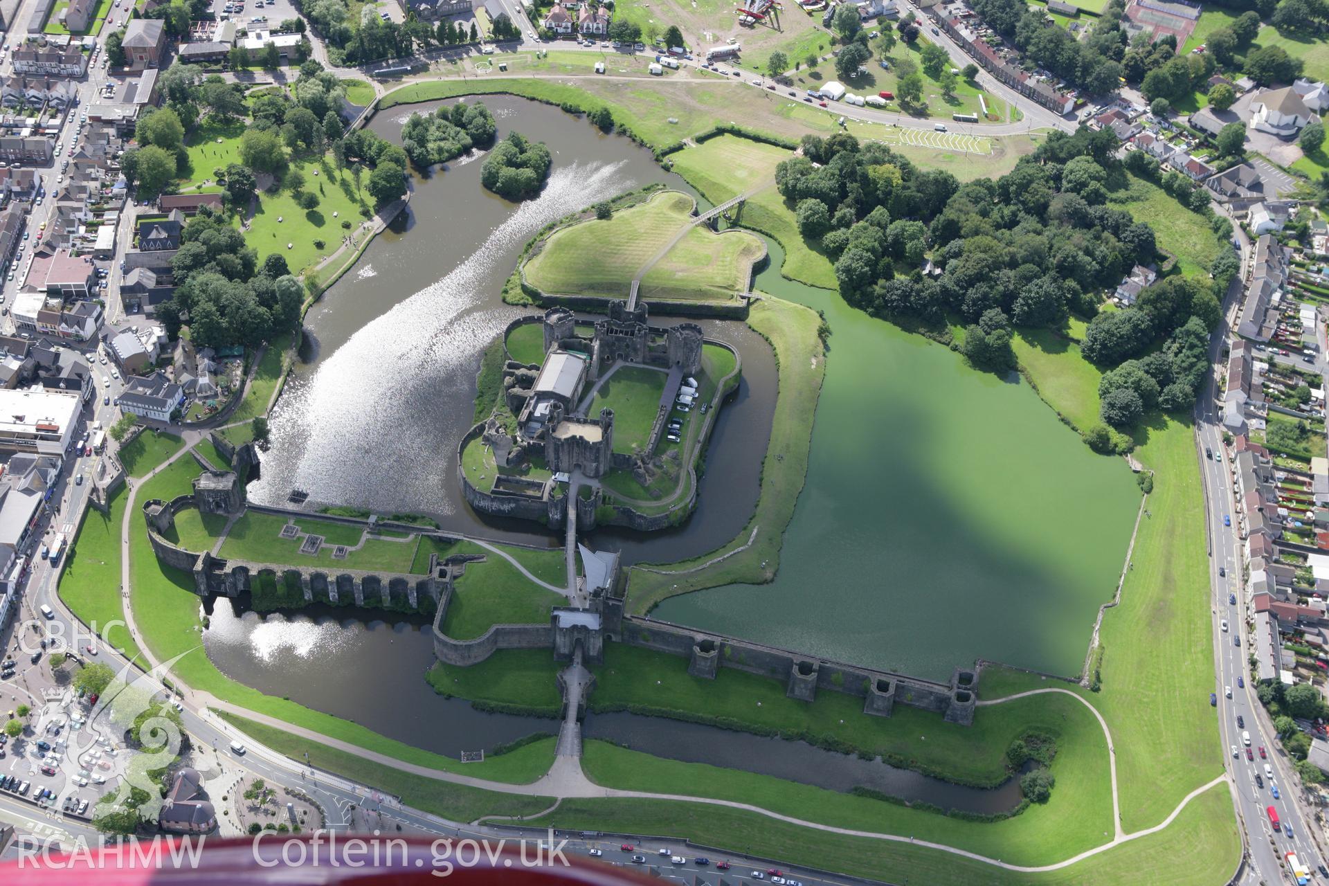 RCAHMW colour oblique aerial photograph of Caerphilly Castle with shadows. Taken on 30 July 2007 by Toby Driver