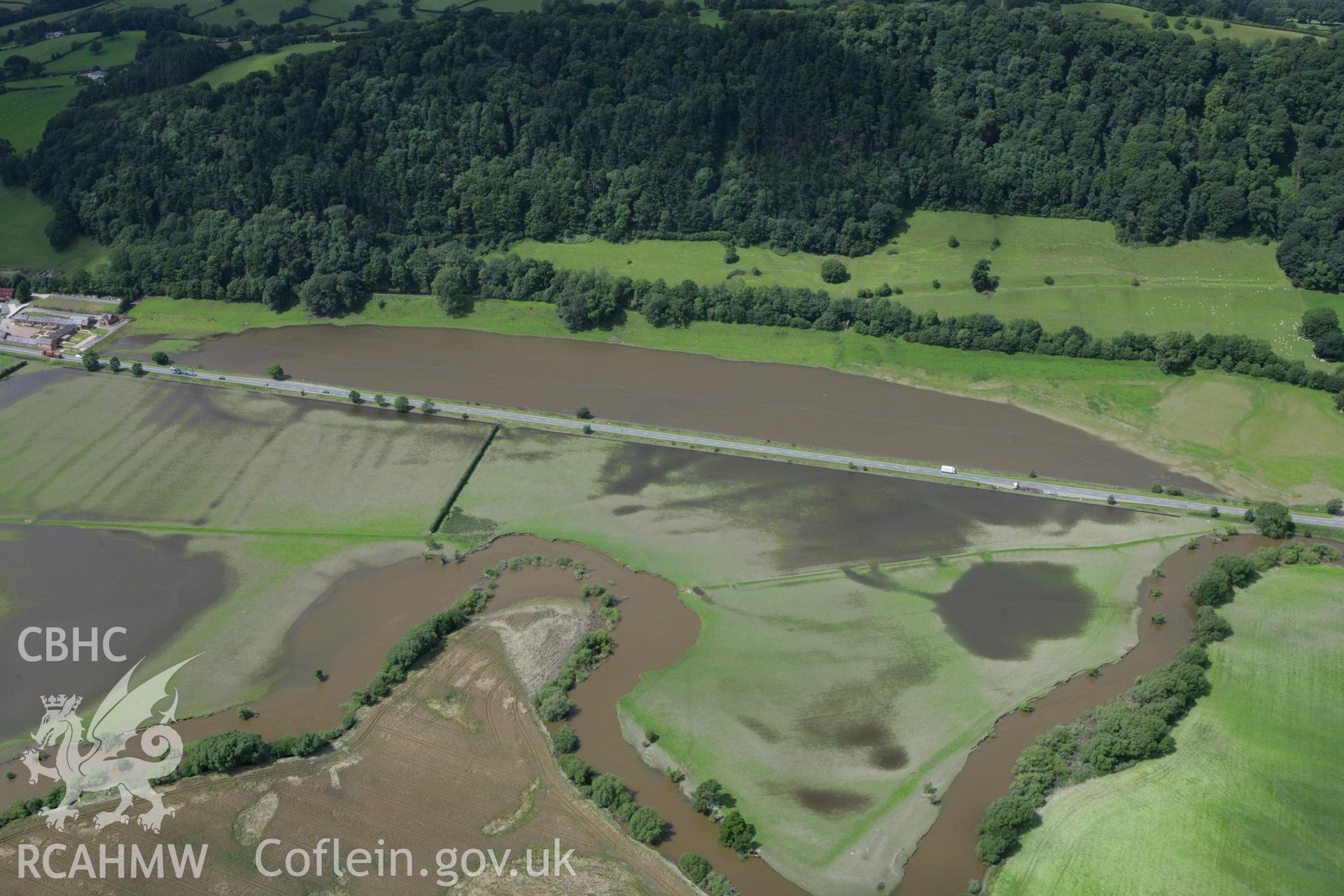 RCAHMW colour oblique aerial photograph of River Severn in flood near Buttington. Taken on 24 July 2007 by Toby Driver