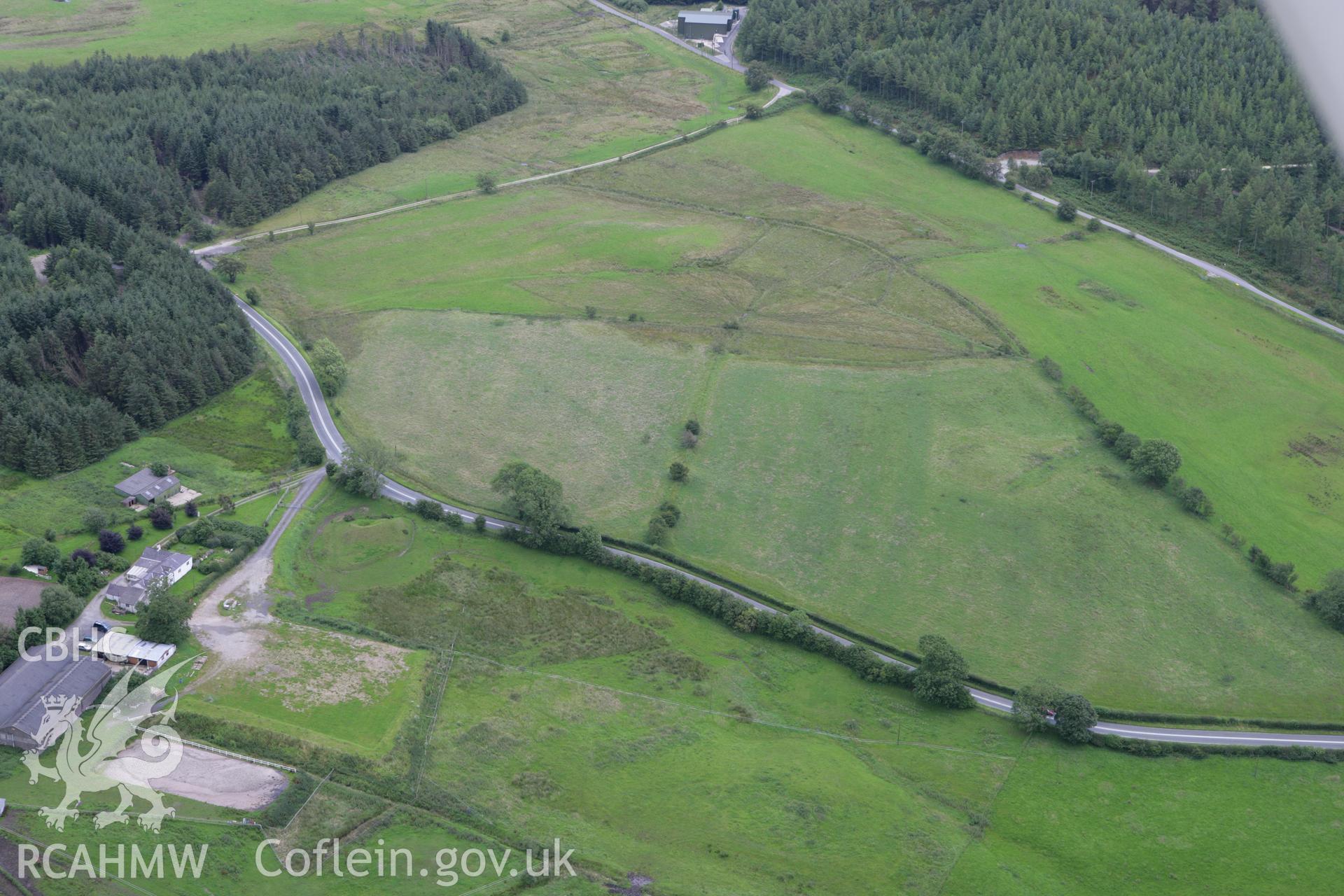 RCAHMW colour oblique aerial photograph of Maes Maelor Mound barrows. Taken on 24 July 2007 by Toby Driver